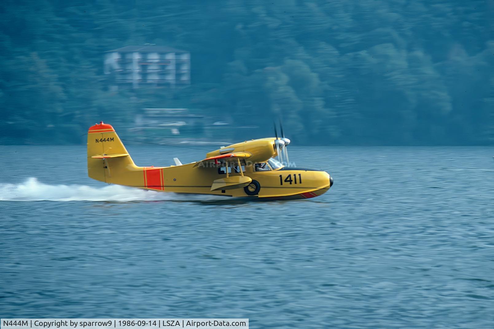 N444M, 1945 Grumman G-44A Widgeon, c/n 1411, Taking-off from Lake Lugano. SPAS-Meeting at Morcote, near Lugano. 
Scanned from a slide