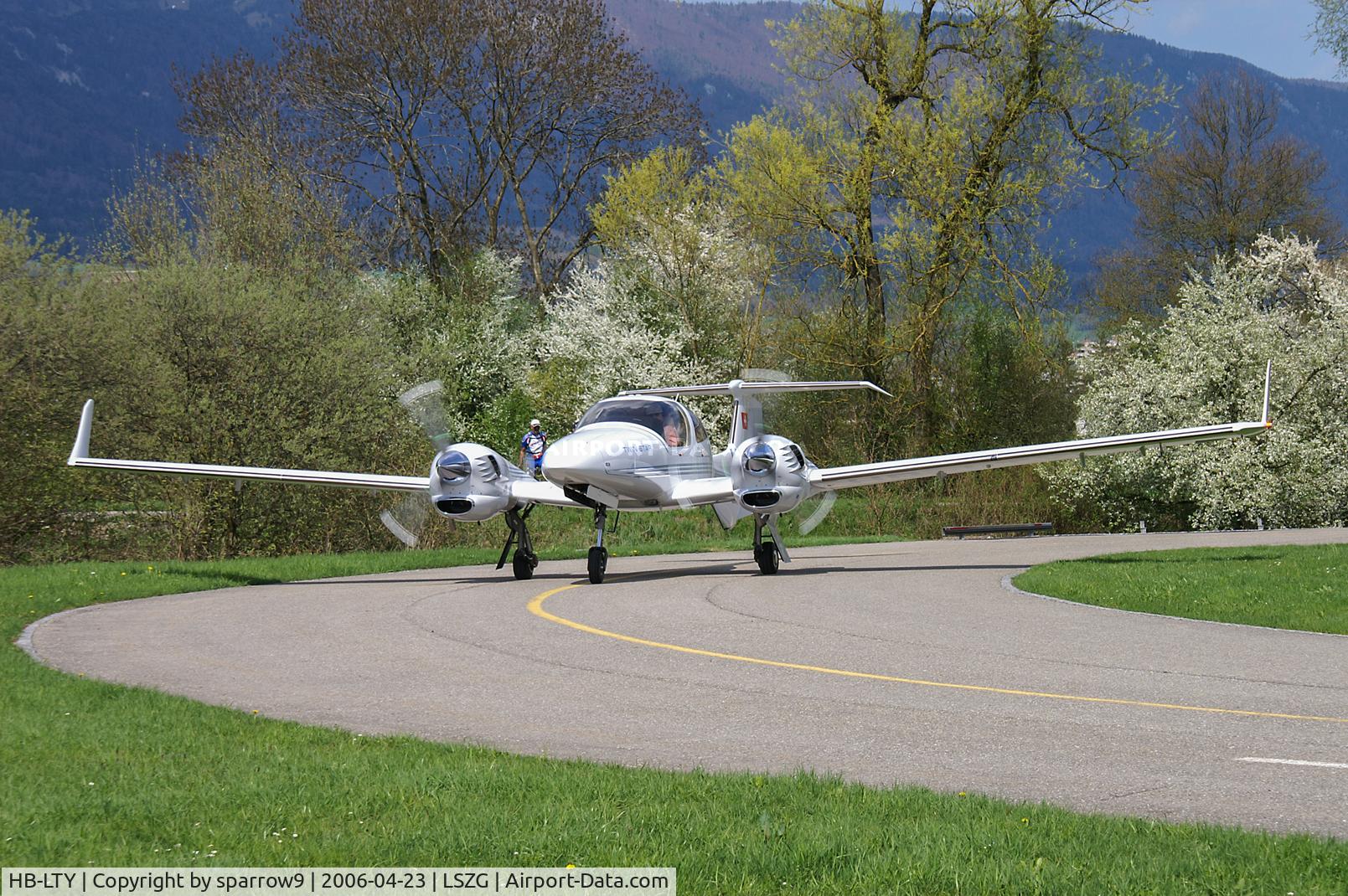 HB-LTY, 2005 Diamond DA-42 Twin Star, c/n 42.069, Head-on view coming from its hangar