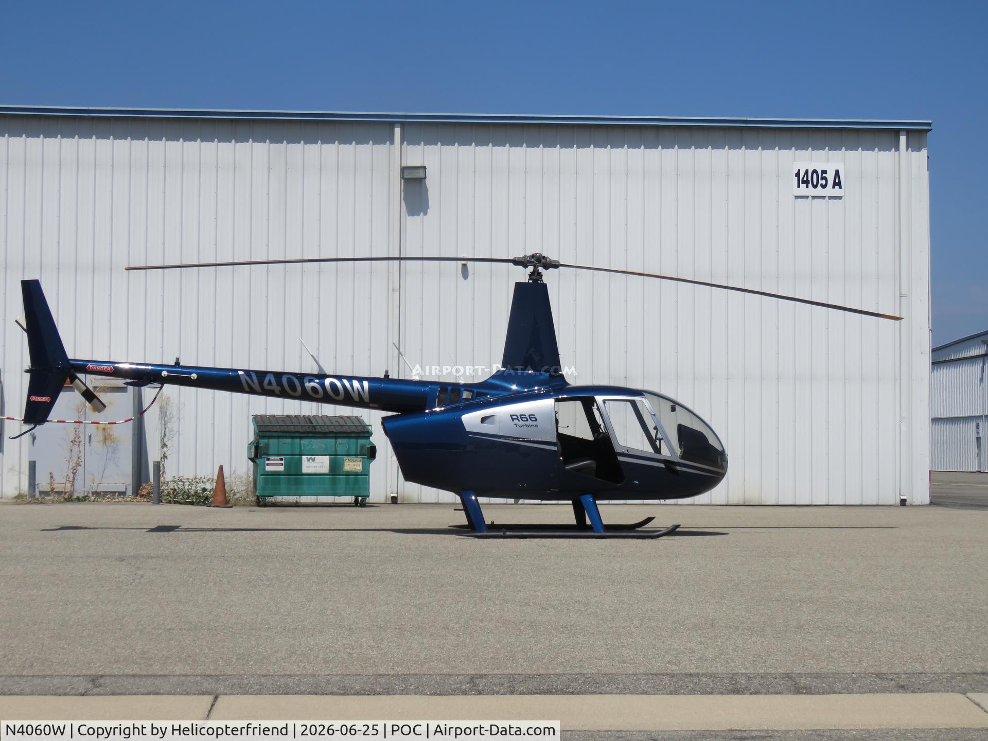N4060W, 2021 Robinson R66 Turbine, c/n 1031, Parked by a hanger