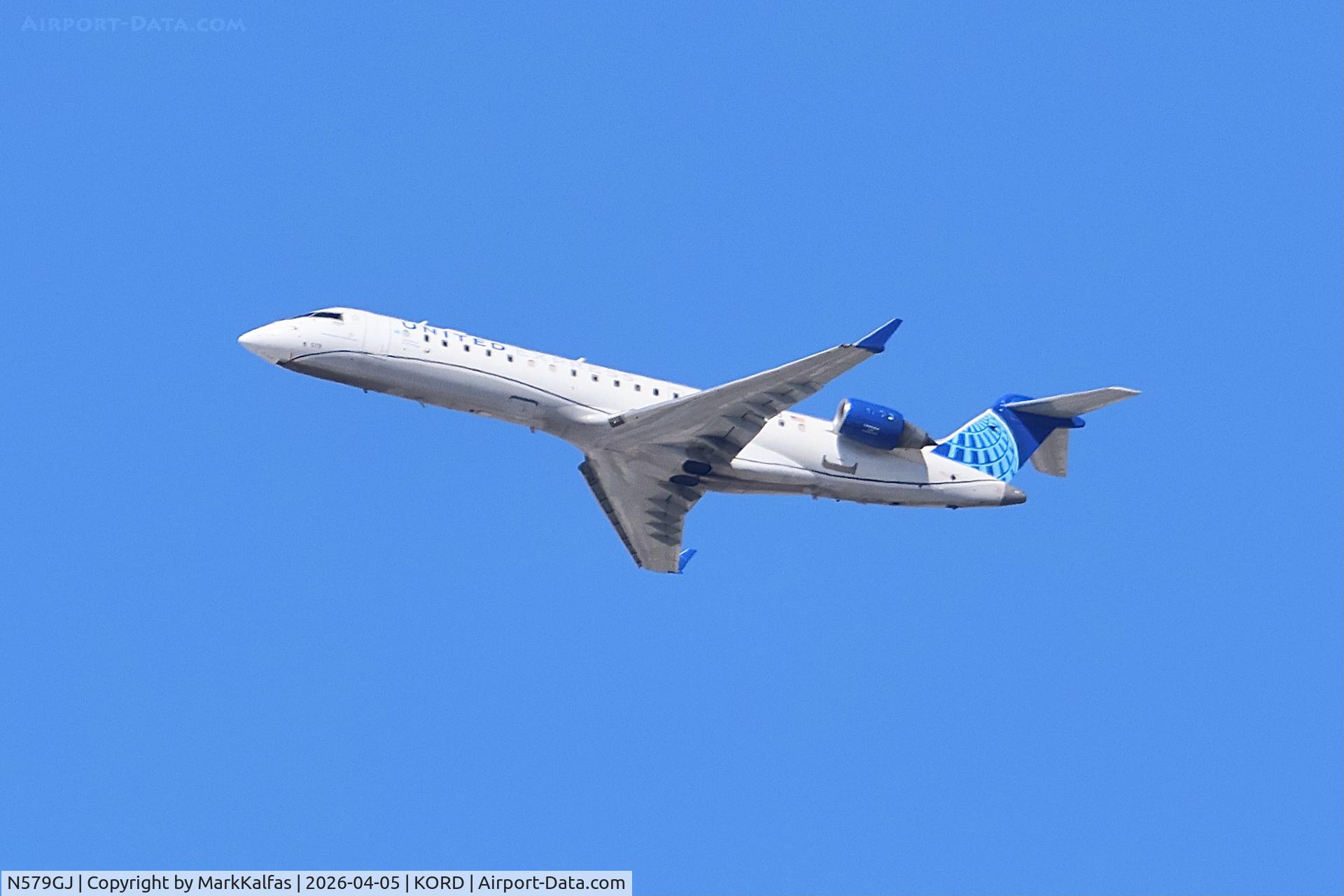 N579GJ, 2003 Bombardier CL-600-2C11, c/n 10085, CRJ7 GoJet / United Express Canadair Regional Jet CRJ-550 N579GJ departing 27L KORD