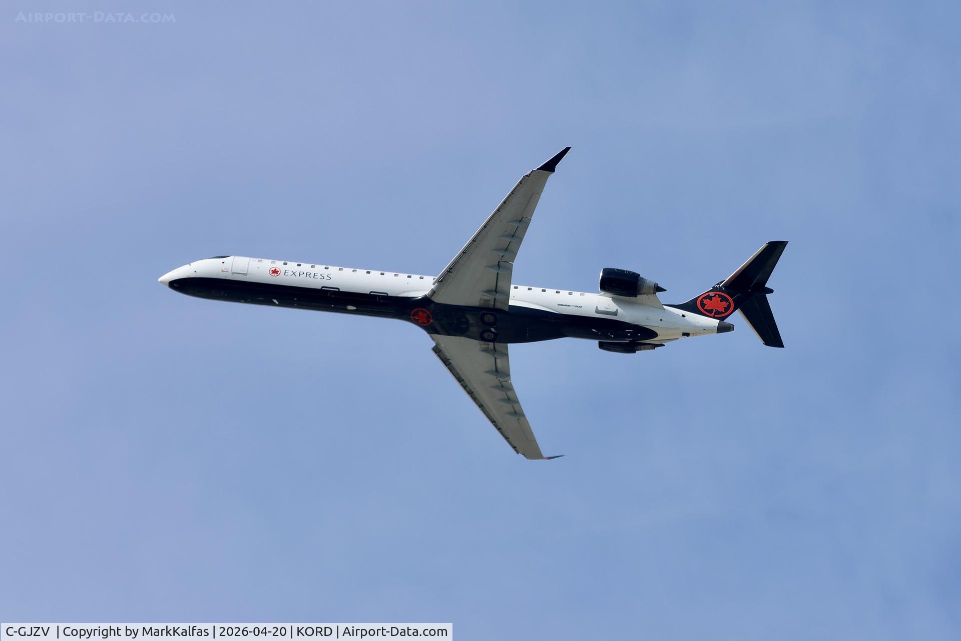 C-GJZV , 2010 Eurocopter EC-120B Colibri, c/n 1595, CRJ9 Jazz /Air Canada express Bombardier CRJ-900 C-GJZV departing 28R KORD