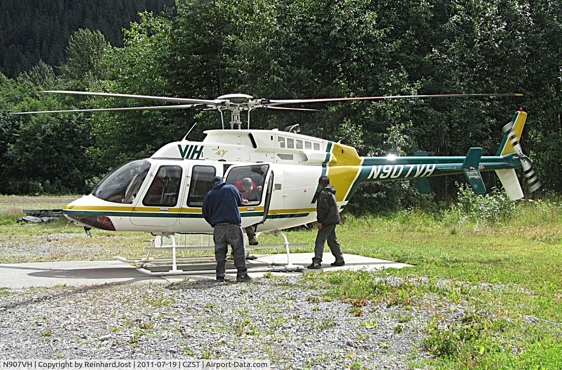 N907VH, 2009 Bell 407, c/n 53976, VIH Helicopters Bell 407 changing passengers at Stewart, BC