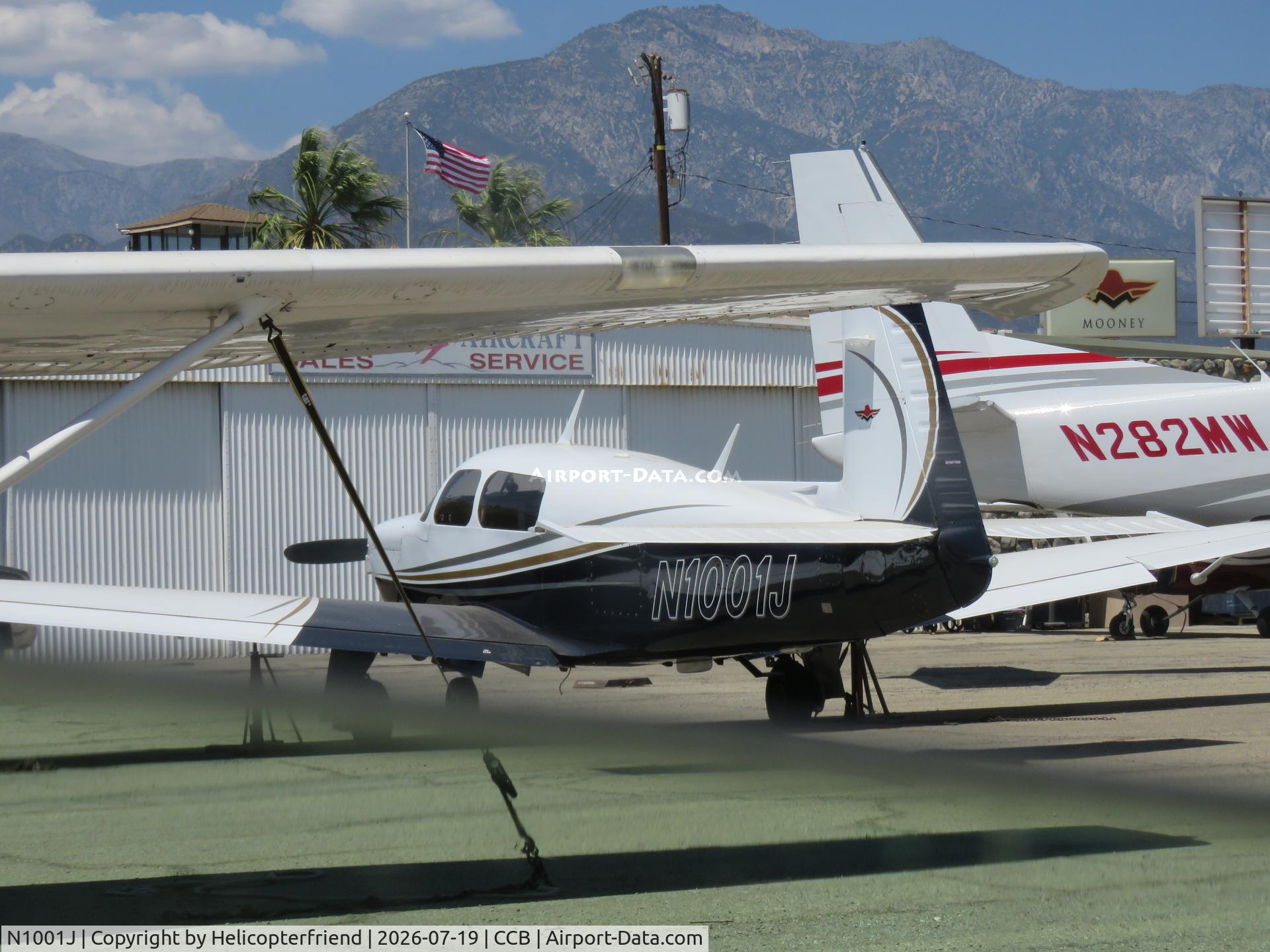 N1001J, 1982 Mooney M20J 201, c/n 24-3095, Parked amongst aircraft awaiting maintenance