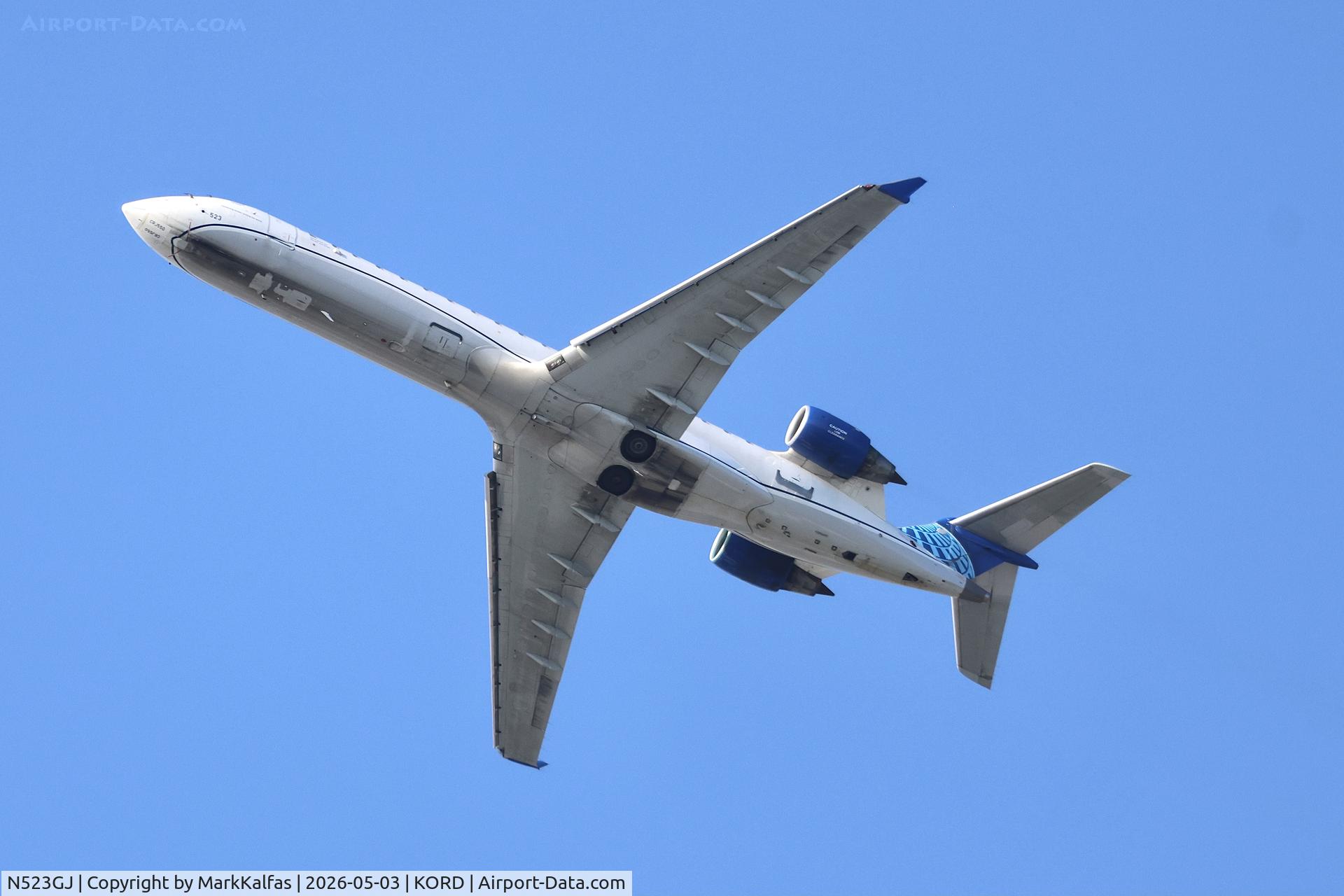Aircraft N523GJ, 2003 Bombardier CL-600-2C11, c/n 10125, CRJ7 GoJet/United Express Bombardier CRJ-701 (CRJ-550) CL-600-2C10 N523GJ deoarting 28R KORD, at KORD, photo by MarkKalfas