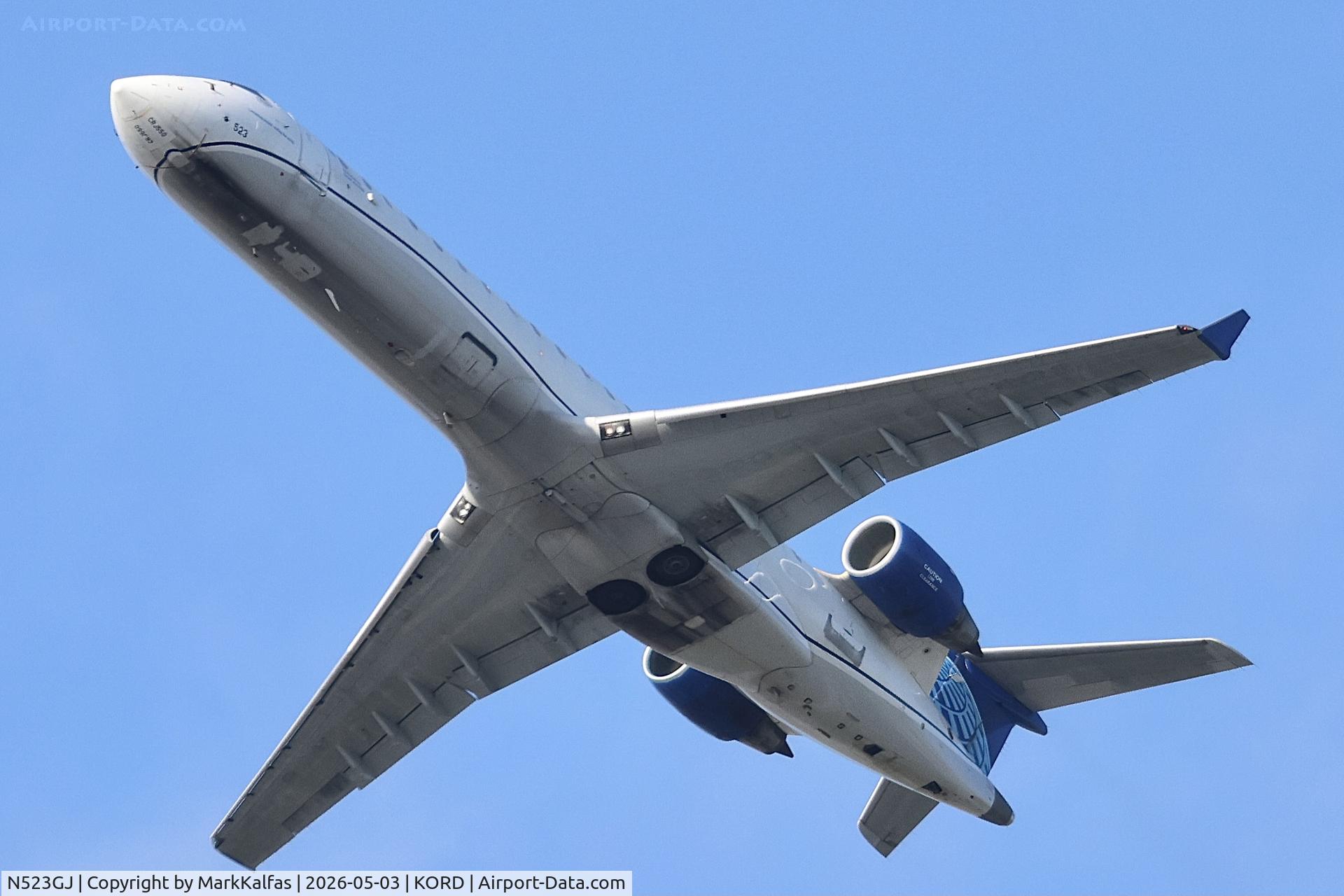 Aircraft N523GJ, 2003 Bombardier CL-600-2C11, c/n 10125, CRJ7 GoJet/United Express Bombardier CRJ-701 (CRJ-550) CL-600-2C10 N523GJ deoarting 28R KORD, at KORD, photo by MarkKalfas