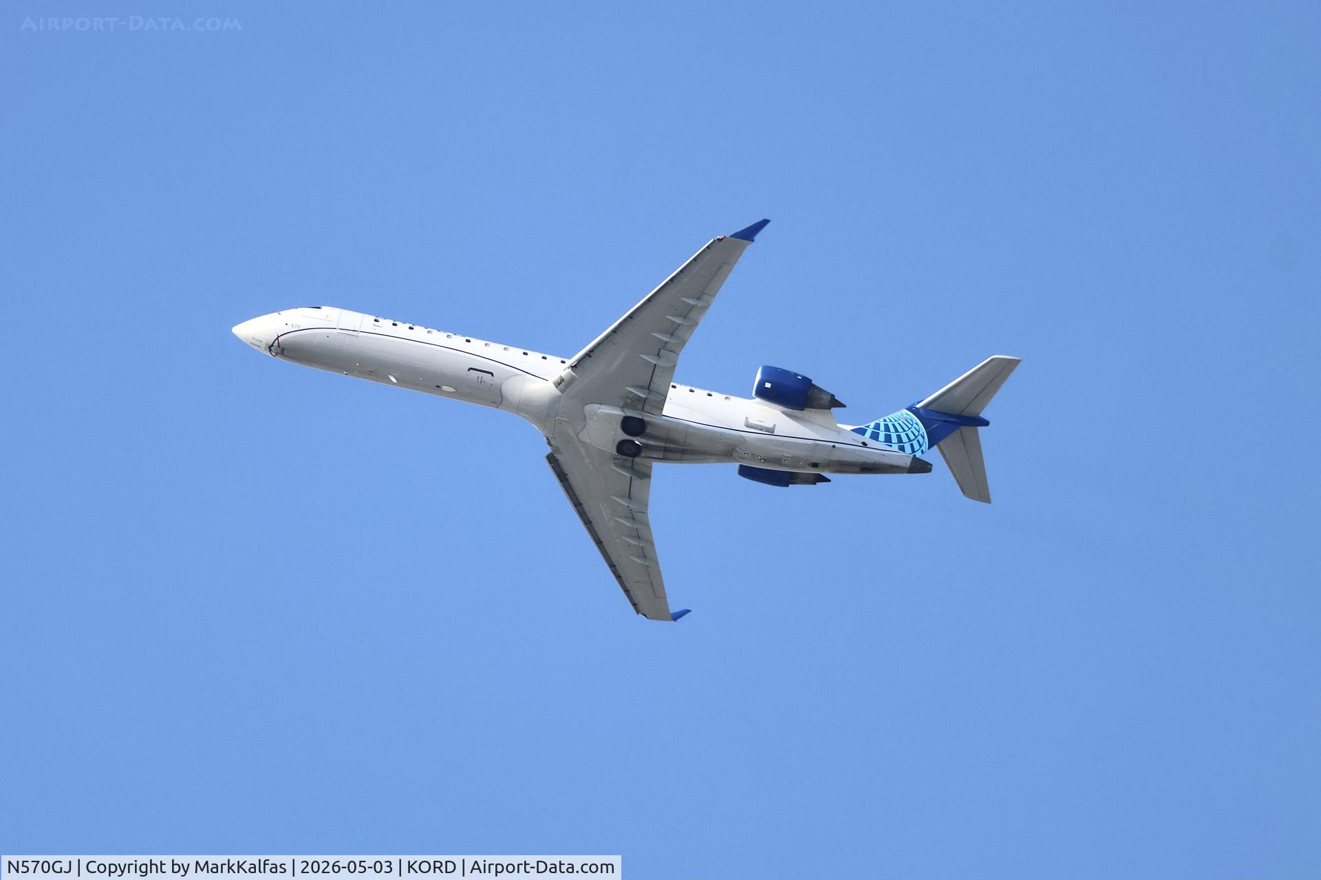 N570GJ, 2003 Bombardier CRJ-701 (CL-600-2C10) Regional Jet, c/n 10111, CRJ7 SkyWest / United Express Canadair Regional Jet CRJ-550 N579GJ departing 28R KORD