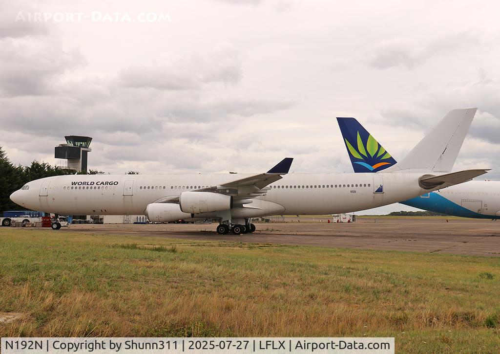 Aircraft N192N, 1998 Airbus A340-313X, c/n 245, Parked with still World Cargo titles..., at LFLX, photo by Shunn311