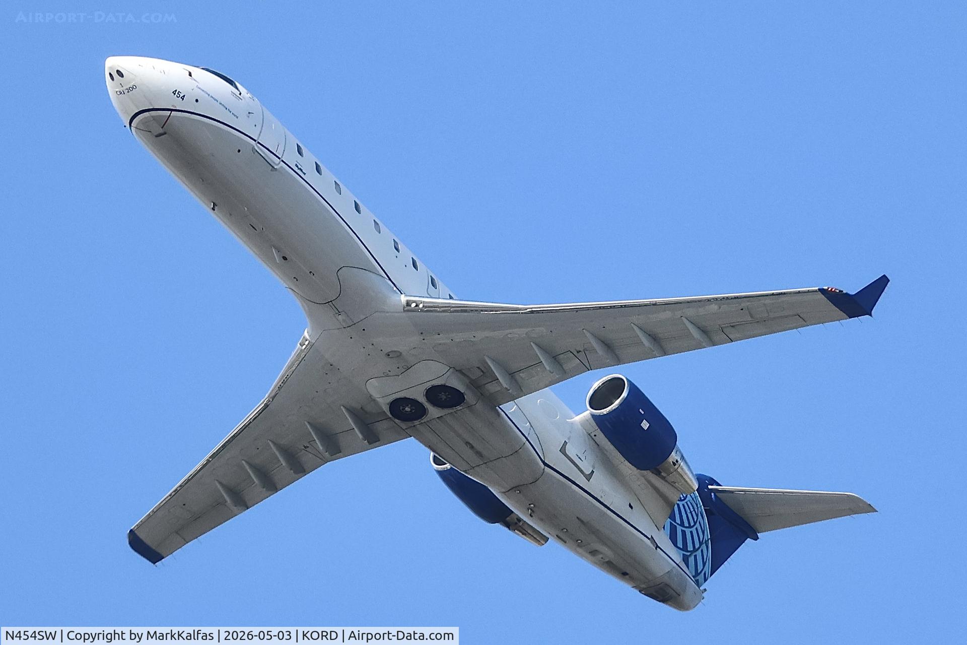 Aircraft N454SW, 2003 Bombardier CRJ-200LR (CL-600-2B19), c/n 7749, CRJ2 SkyWest / United Express Bombardier CRJ-200LR, N454SW departing 28R KORD, at KORD, photo by MarkKalfas