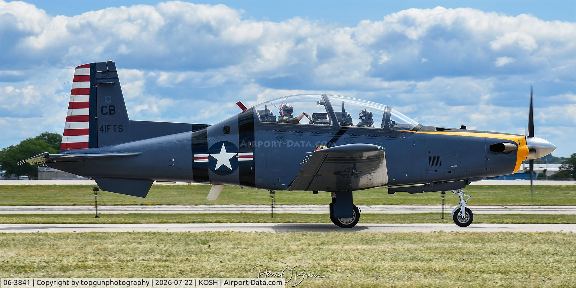 Aircraft 06-3841, Raytheon T-6A Texan II, c/n PT-396, MAFIA41 taxis to the Boeing Plaza at Oshkosh 26, at KOSH, photo by topgunphotography