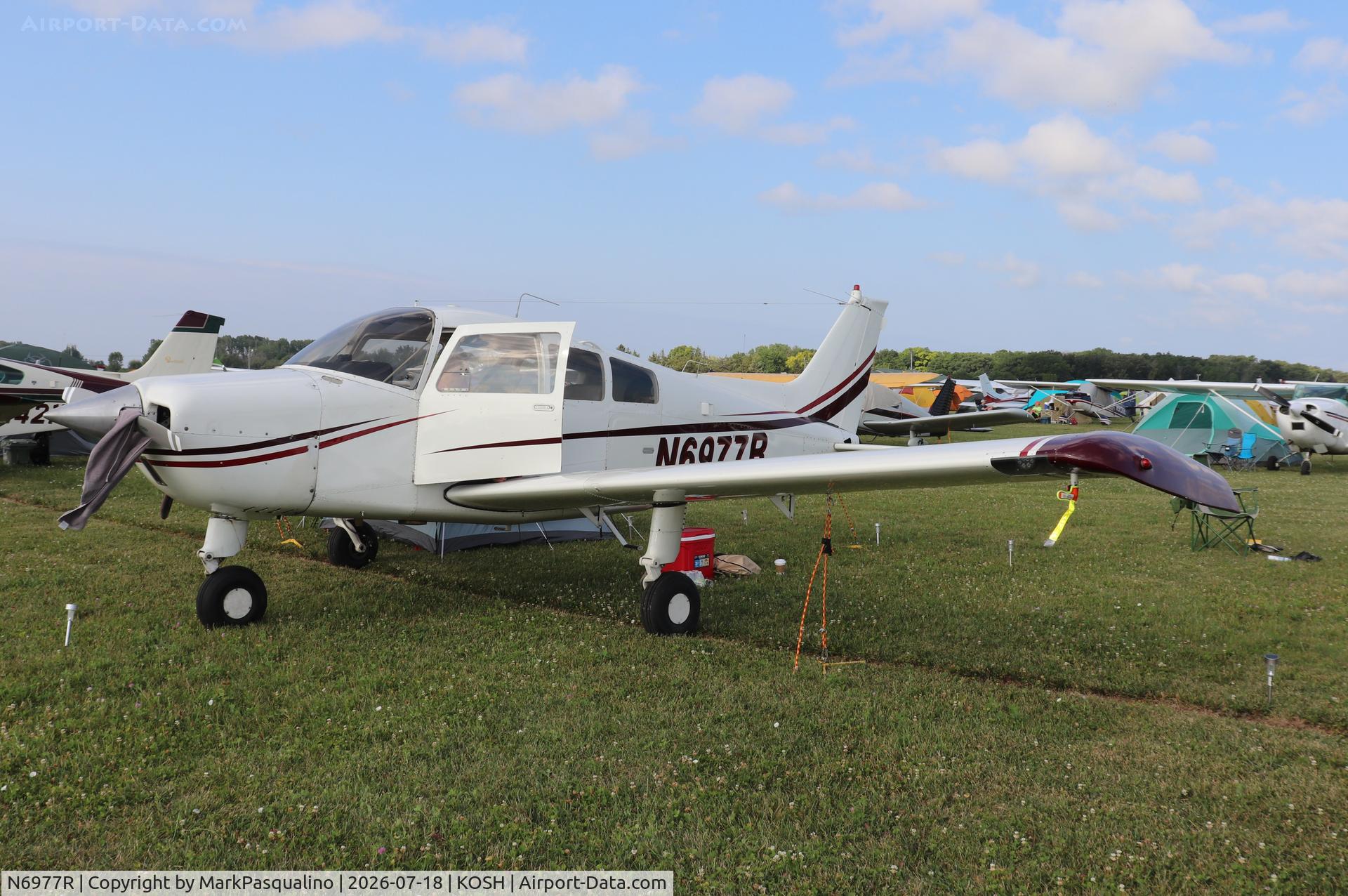 Aircraft N6977R, 1974 Beech C23 Sundowner 180, c/n M-1620, Beech C23, at KOSH, photo by MarkPasqualino