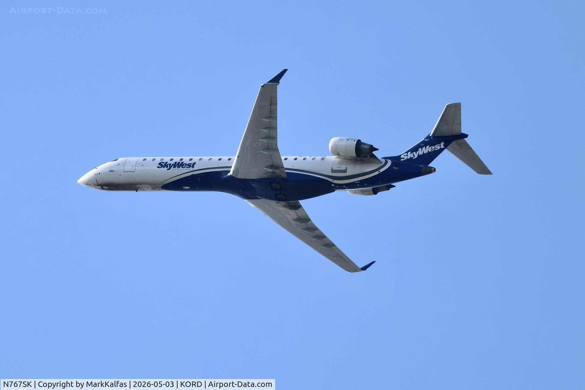 Aircraft N767SK, 2005 Bombardier CRJ-702 (CL-600-2C10) Regional Jet, c/n 10233, CRJ7 SkyWest / United Express Bombardier CRJ-702 N767SK departing 28R KORD, at KORD, photo by MarkKalfas