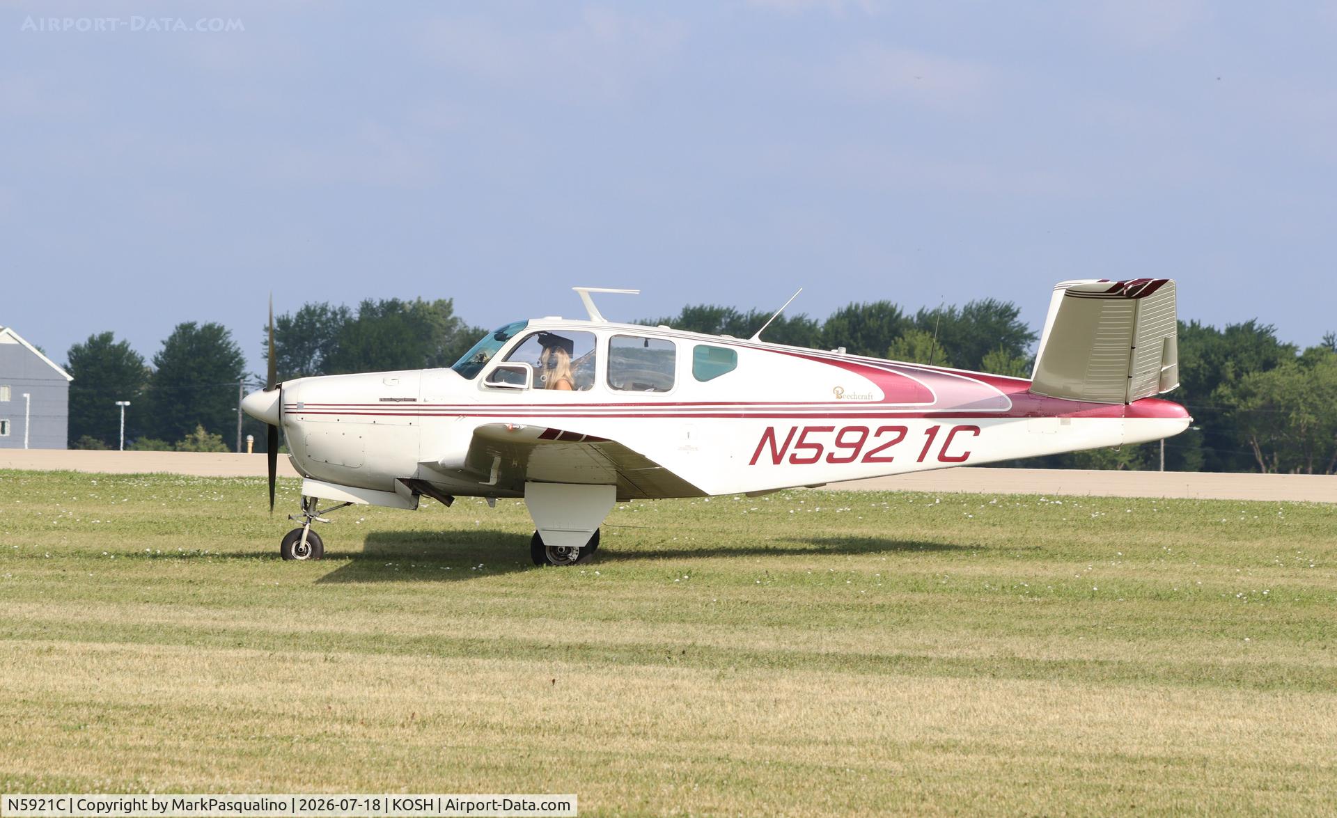 Aircraft N5921C, Beech C35 Bonanza, c/n D-3281, Beech C35, at KOSH, photo by MarkPasqualino