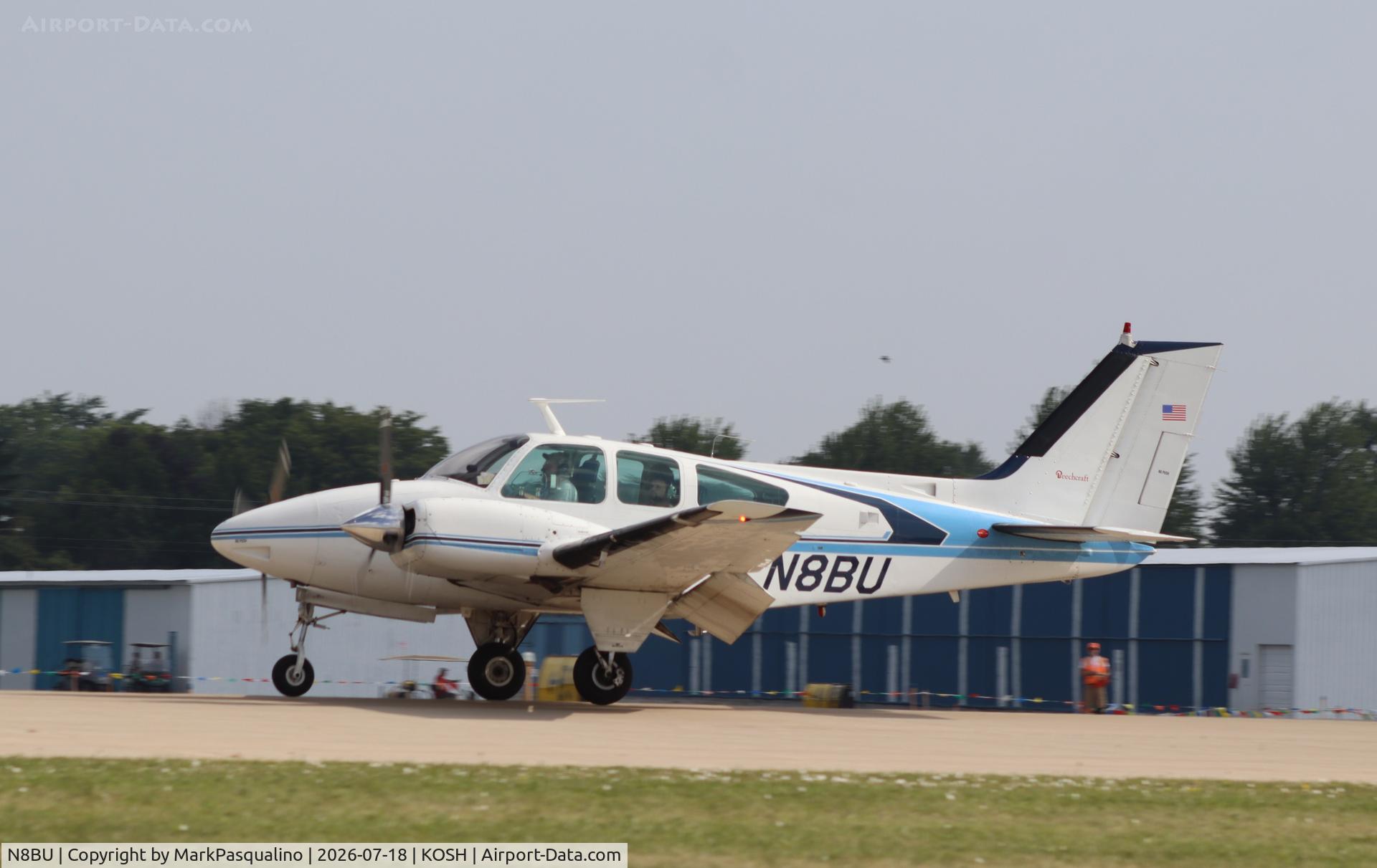 Aircraft N8BU, 1970 Beech 95-B55 Baron, c/n TC-1322, Beech B55, at KOSH, photo by MarkPasqualino