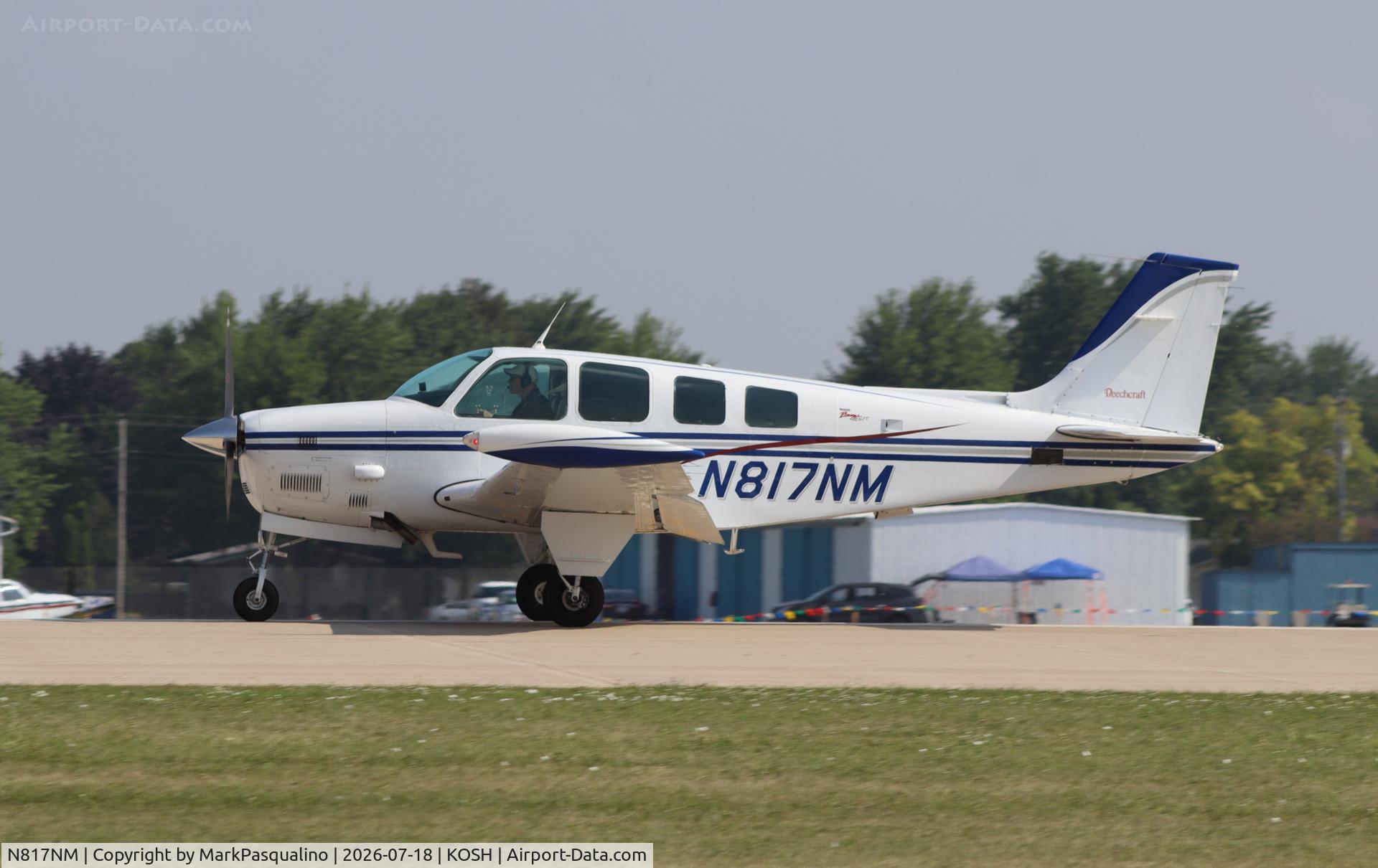 Aircraft N817NM, 1979 Beech A36TC Bonanza 36, c/n EA-27, Beech A36TC, at KOSH, photo by MarkPasqualino