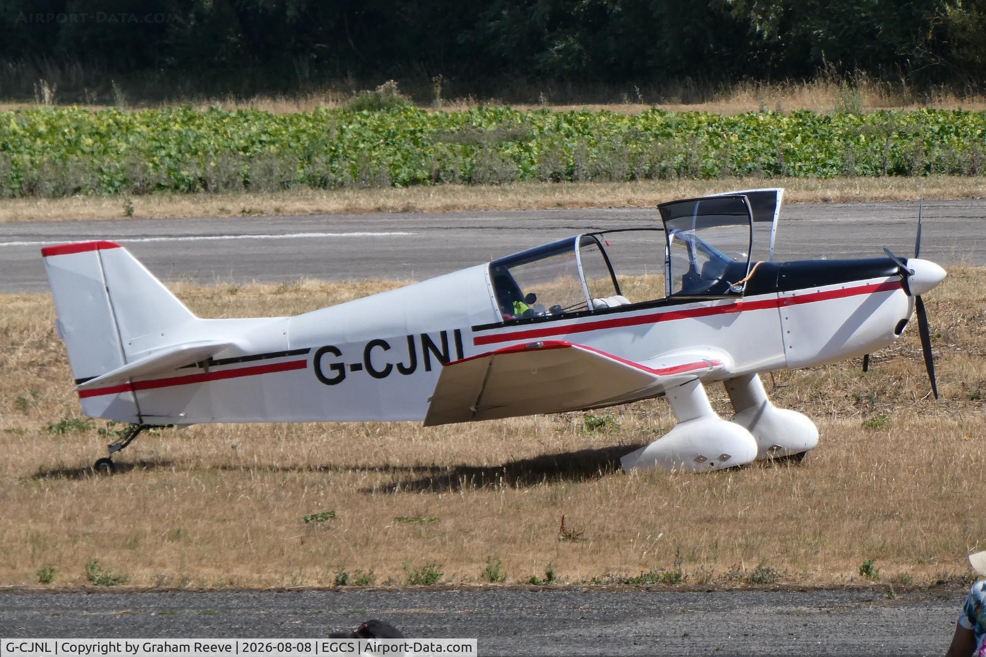 Aircraft G-CJNL, 2016 Jodel DR-1050M replica, c/n LAA 304-15103, Parked at Sturgate,, at EGCS, photo by Graham Reeve