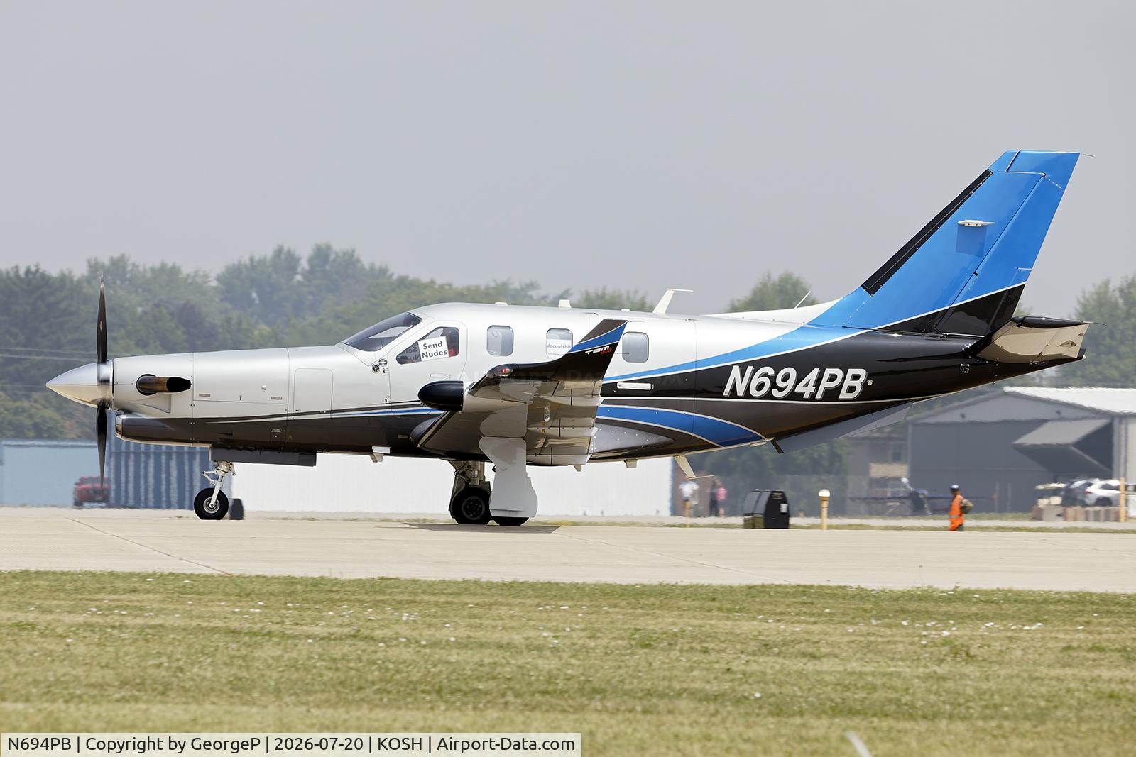 Aircraft N694PB, 2014 Socata TBM-700, c/n 1043, I don't know where these guys were proposing to park, but I admire their optimism! Airventure 2026., at KOSH, photo by GeorgeP