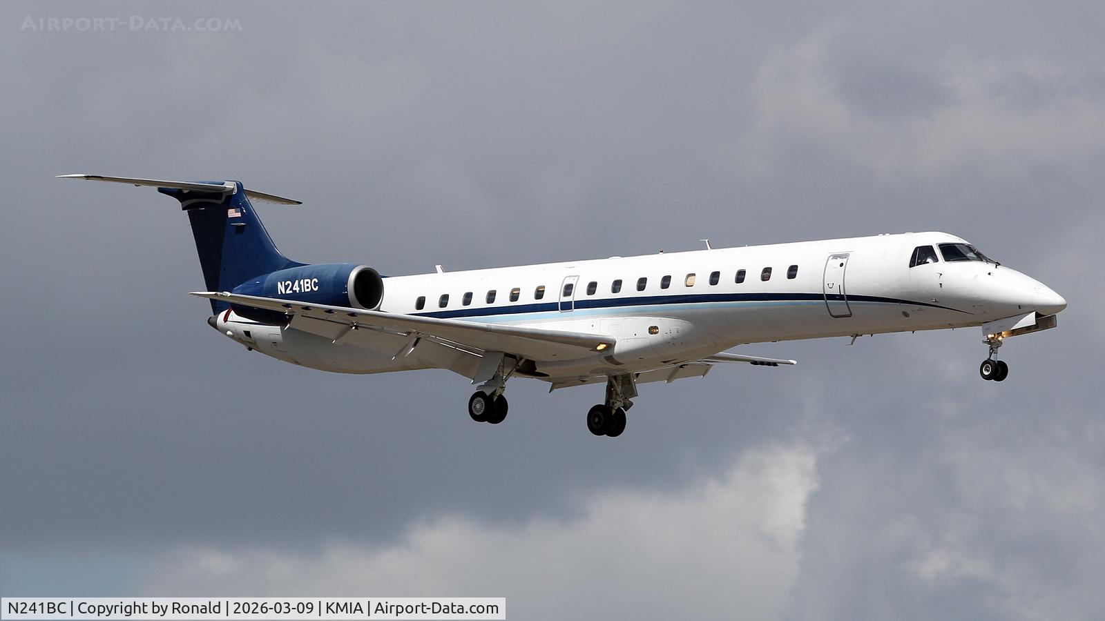 Aircraft N241BC, 1998 Embraer EMB-145EP (ERJ-145EP), c/n 145077, at mia, at KMIA, photo by Ronald
