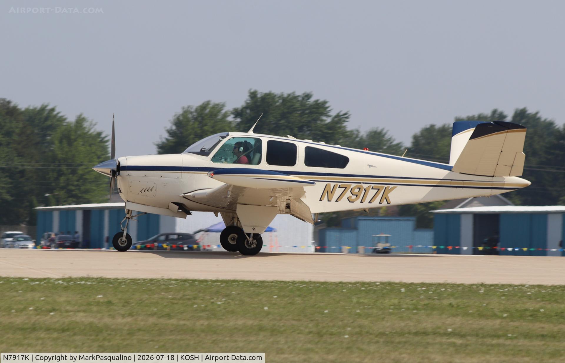 Aircraft N7917K, 1964 Beech S35 Bonanza, c/n D-7416, Beech S35, at KOSH, photo by MarkPasqualino
