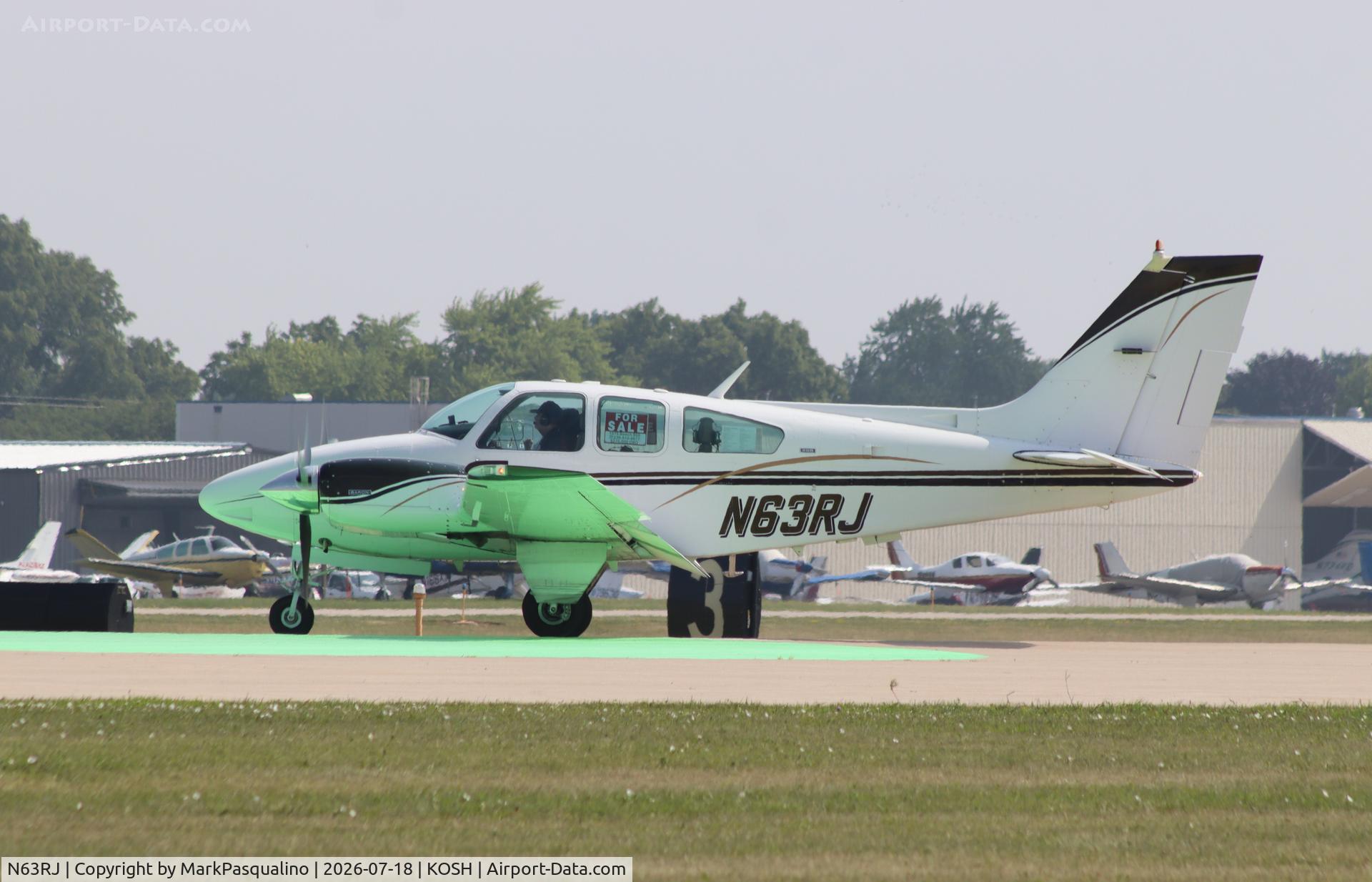 Aircraft N63RJ, 1974 Beech 95-B55 Baron Baron, c/n TC-1804, Beech B55, at KOSH, photo by MarkPasqualino