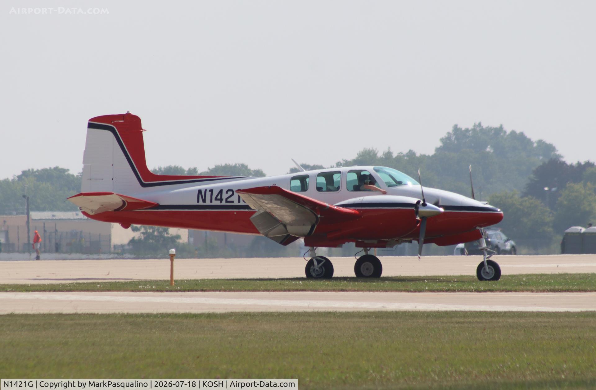 Aircraft N1421G, 1962 Beech D50E Twin Bonanza, c/n DH-333, Beech D50E, at KOSH, photo by MarkPasqualino