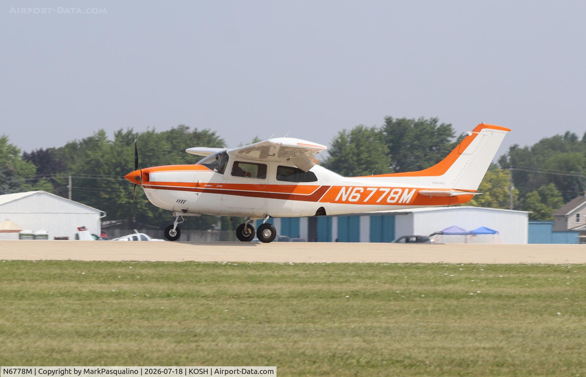 Aircraft N6778M, 1977 Cessna 210M Centurion, c/n 21061990, Cessna 210M, at KOSH, photo by MarkPasqualino