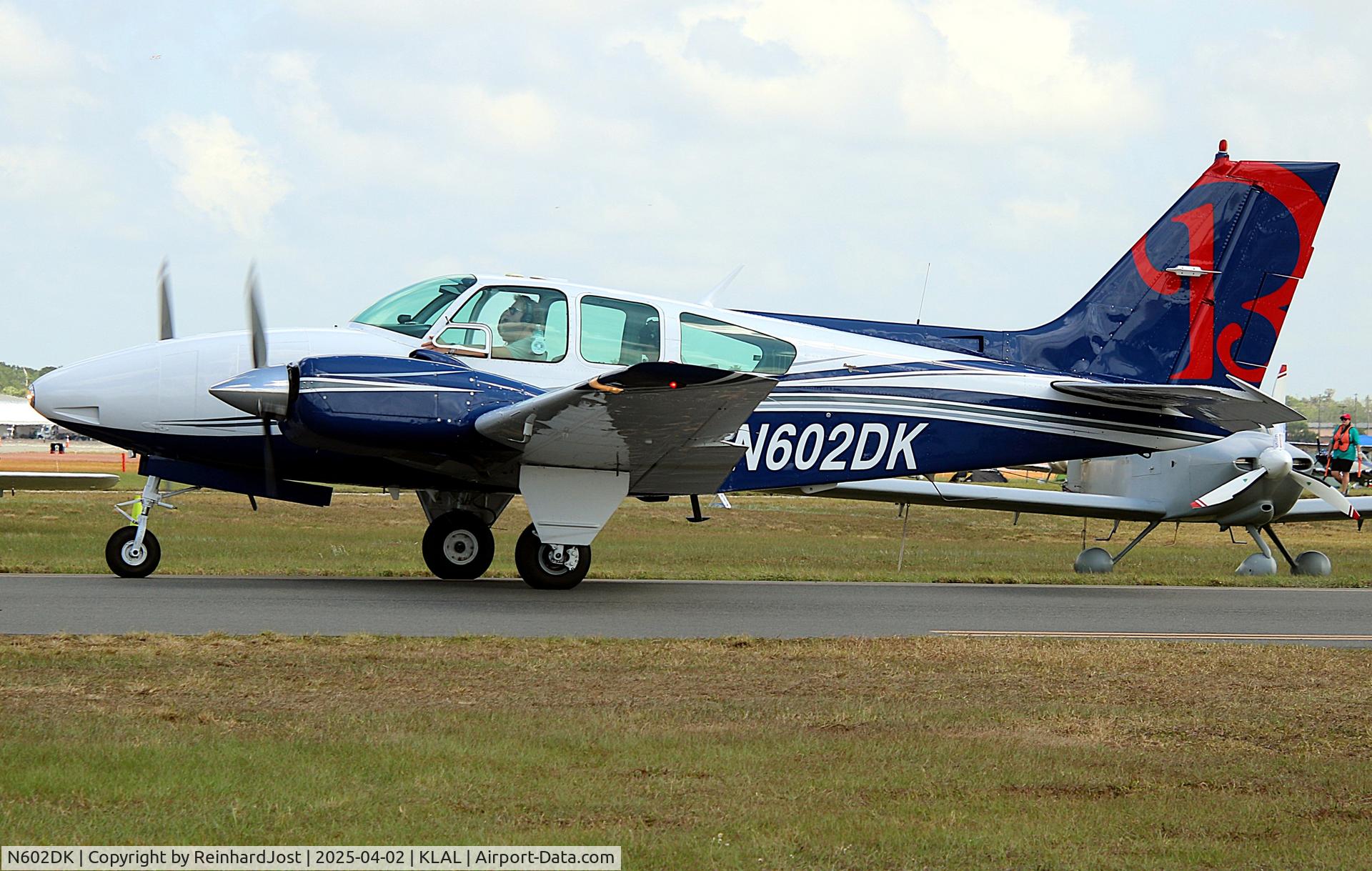 Aircraft N602DK, 1967 Beech C55 Baron (95-C55), c/n TE-369, Arriving at Sun'n'Fun 2025, Lakeland, FL, at KLAL, photo by ReinhardJost