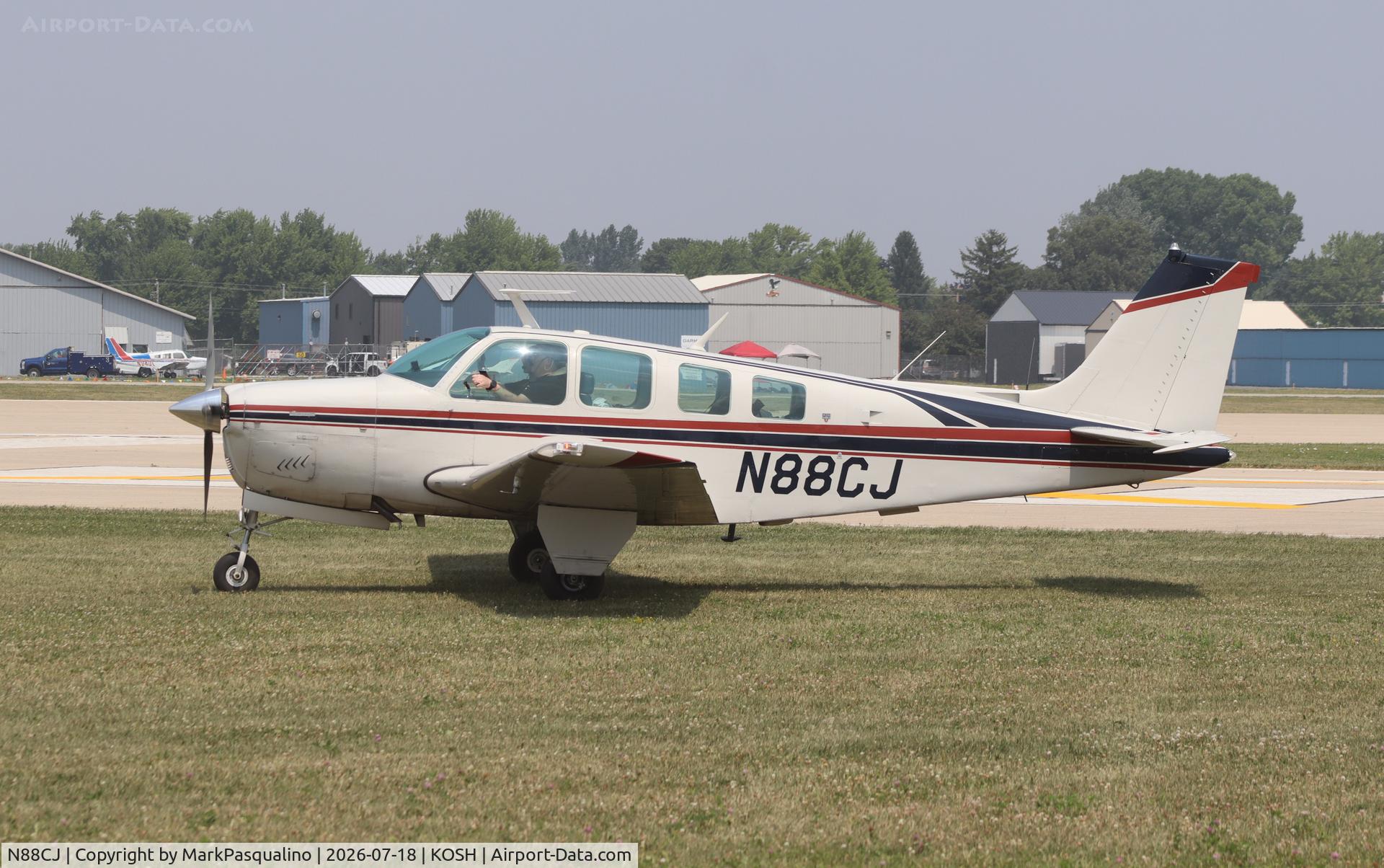Aircraft N88CJ, 1977 Beech A36 Bonanza 36, c/n E-1042, Beech A36, at KOSH, photo by MarkPasqualino