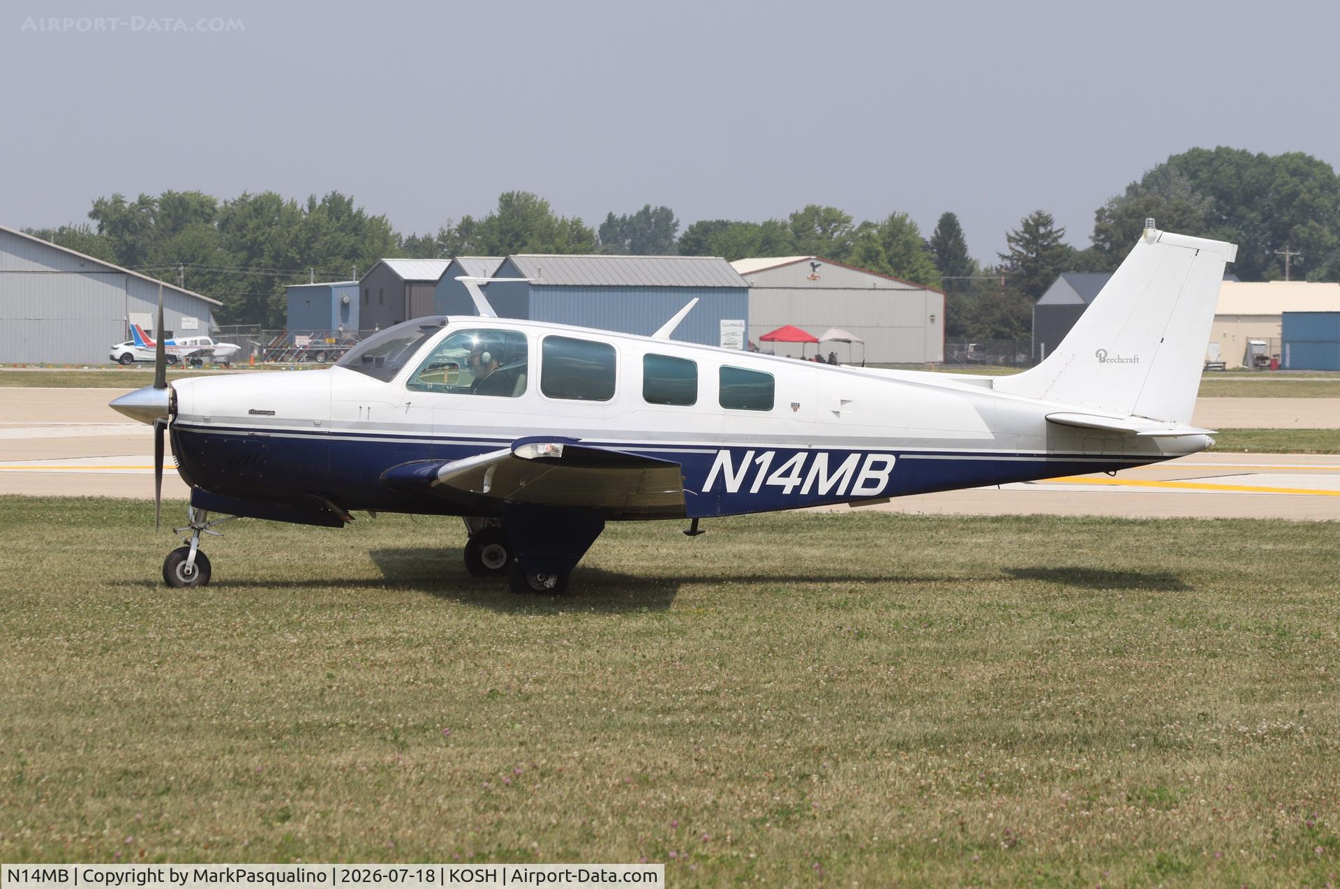 Aircraft N14MB, 1977 Beech A36 Bonanza 36, c/n E-1062, Beech A36, at KOSH, photo by MarkPasqualino