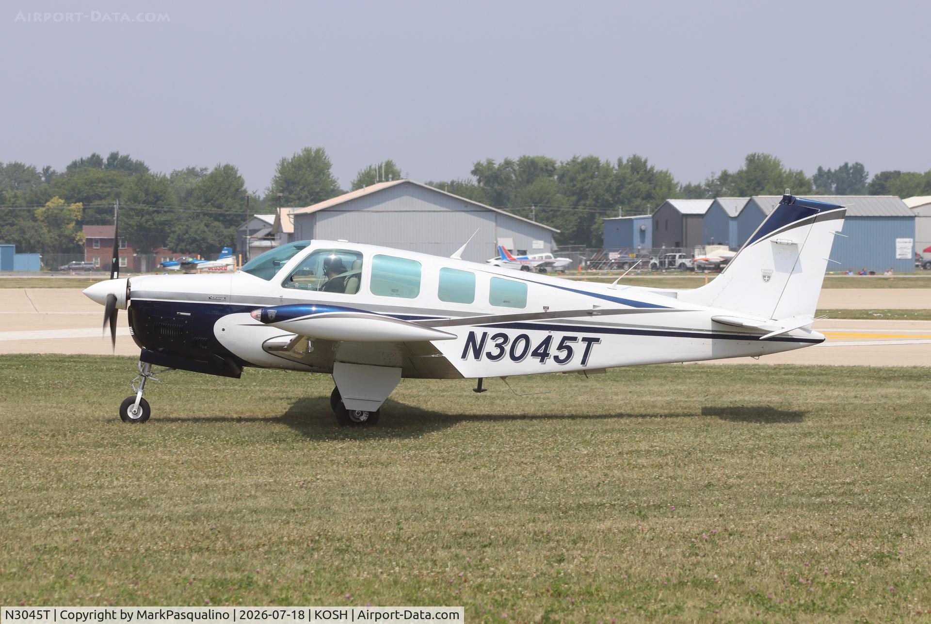 Aircraft N3045T, 1987 Beech A36 Bonanza 36, c/n E-2369, Beech A36, at KOSH, photo by MarkPasqualino