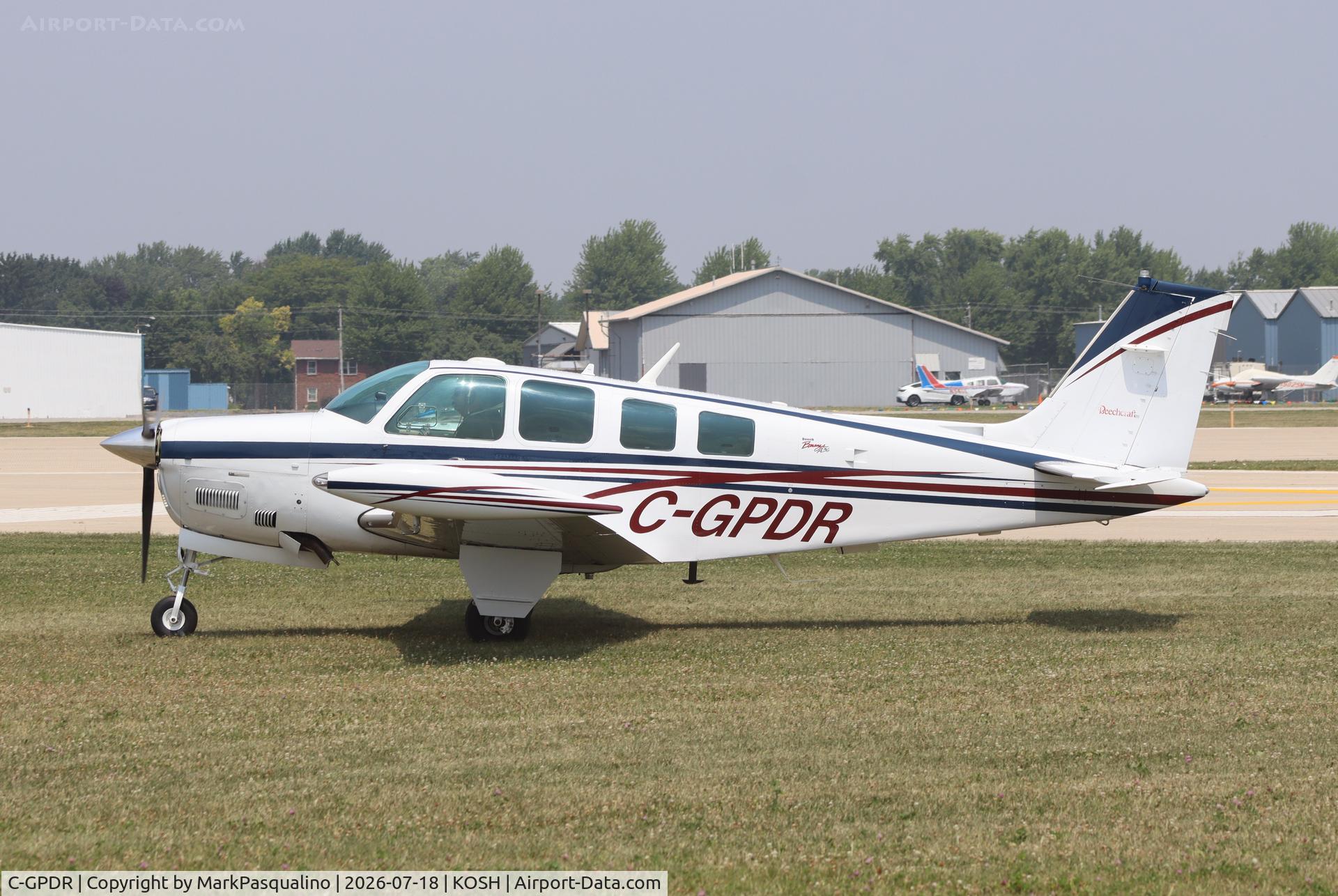 Aircraft C-GPDR, 1999 Beech A36 Bonanza 36, c/n E-3250, Beech A36, at KOSH, photo by MarkPasqualino