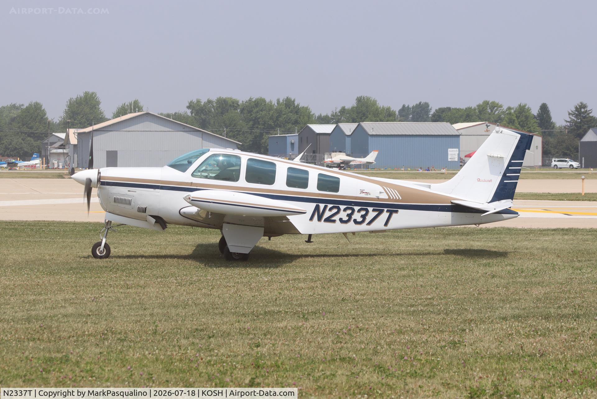 Aircraft N2337T, 1997 Raytheon Aircraft Company A36 Bonanza, c/n E-3137, Beech A36, at KOSH, photo by MarkPasqualino