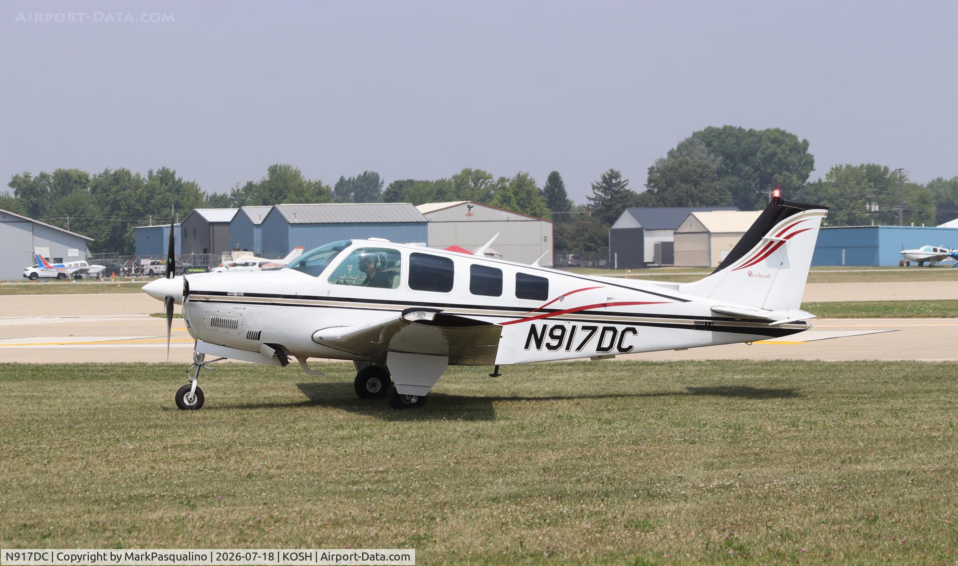 Aircraft N917DC, 1981 Beech A36 Bonanza 36, c/n E-1884, Beech A36, at KOSH, photo by MarkPasqualino