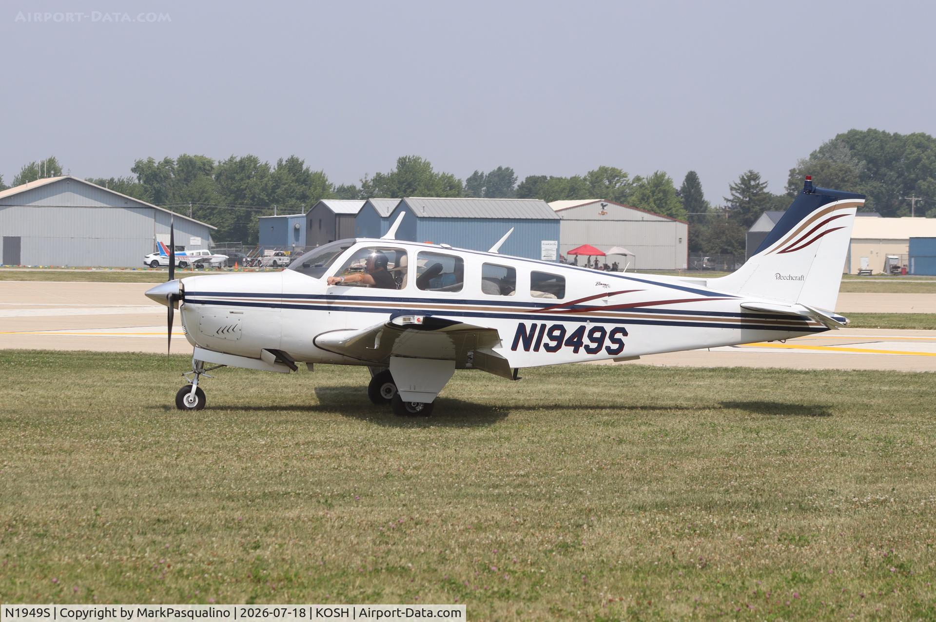Aircraft N1949S, 1977 Beech A36 Bonanza 36, c/n E-1011, Beech A36, at KOSH, photo by MarkPasqualino