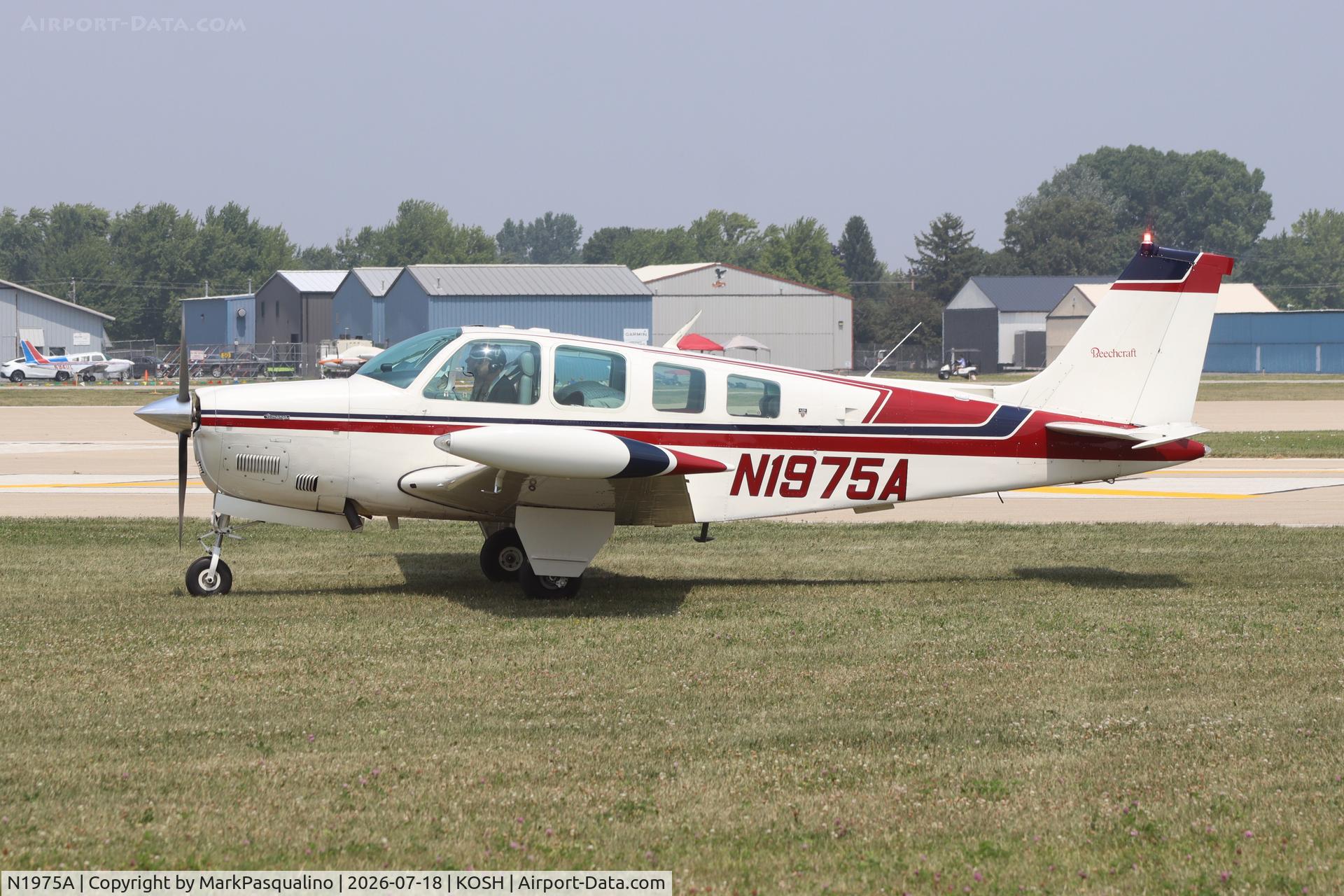Aircraft N1975A, 1976 Beech A36 Bonanza 36, c/n E-860, Beech A36, at KOSH, photo by MarkPasqualino