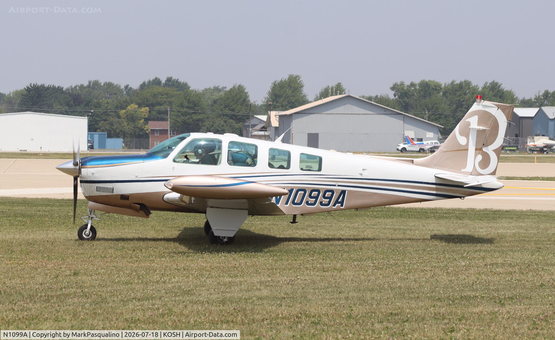 Aircraft N1099A, 1997 Raytheon Aircraft Company A36 Bonanza, c/n E-3088, Beech A36, at KOSH, photo by MarkPasqualino