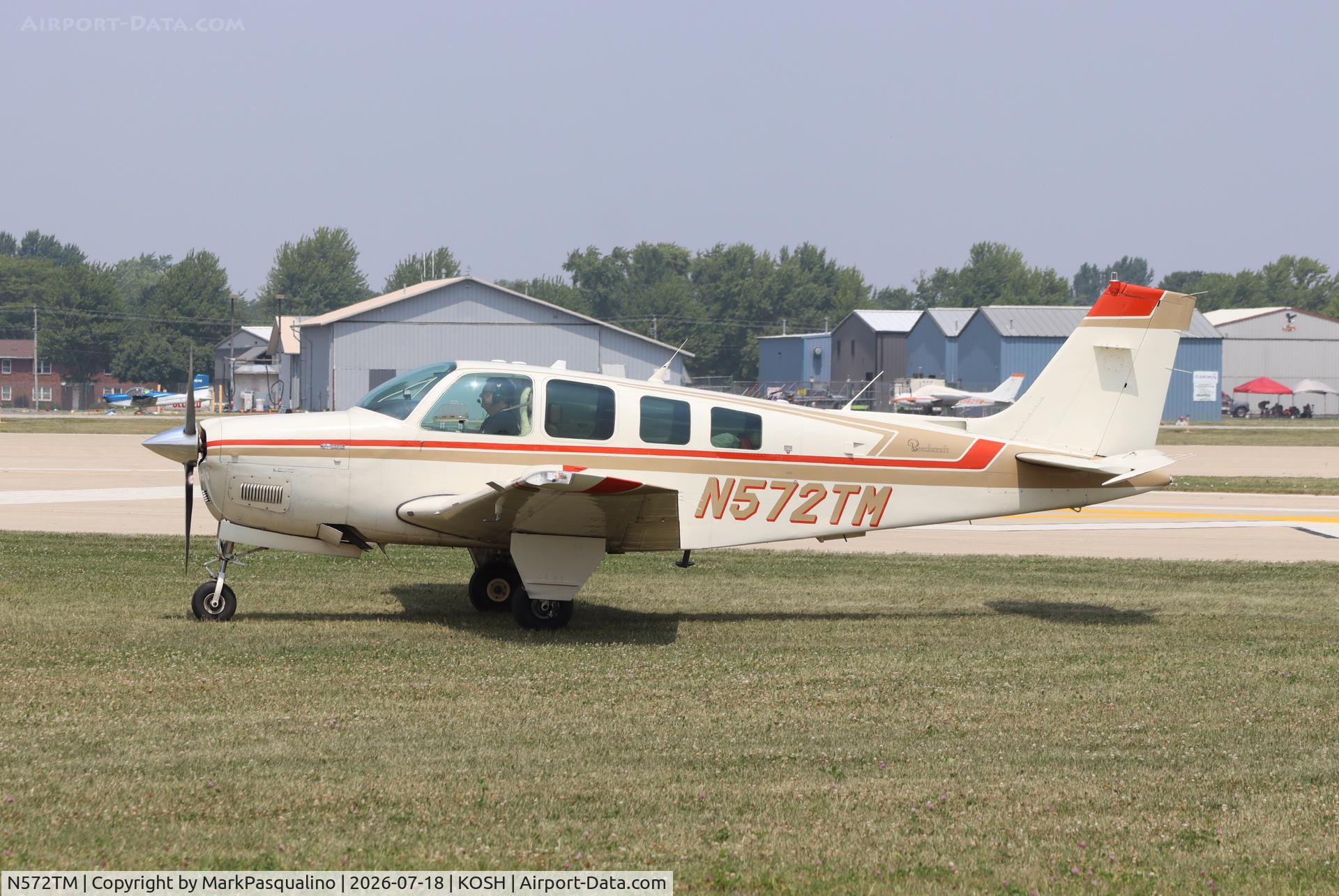 Aircraft N572TM, 1984 Beech A36 Bonanza 36, c/n E-2125, Beech A36, at KOSH, photo by MarkPasqualino