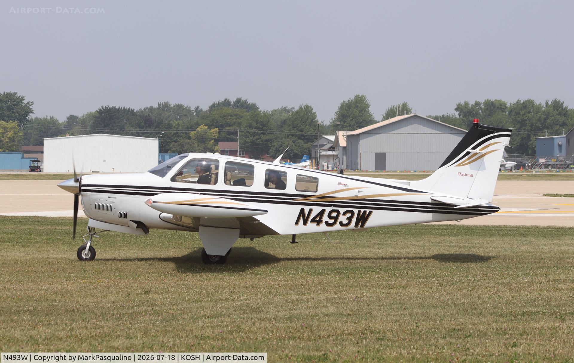 Aircraft N493W, Raytheon Aircraft Company A36 Bonanza, c/n E-3493, Beech A36, at KOSH, photo by MarkPasqualino