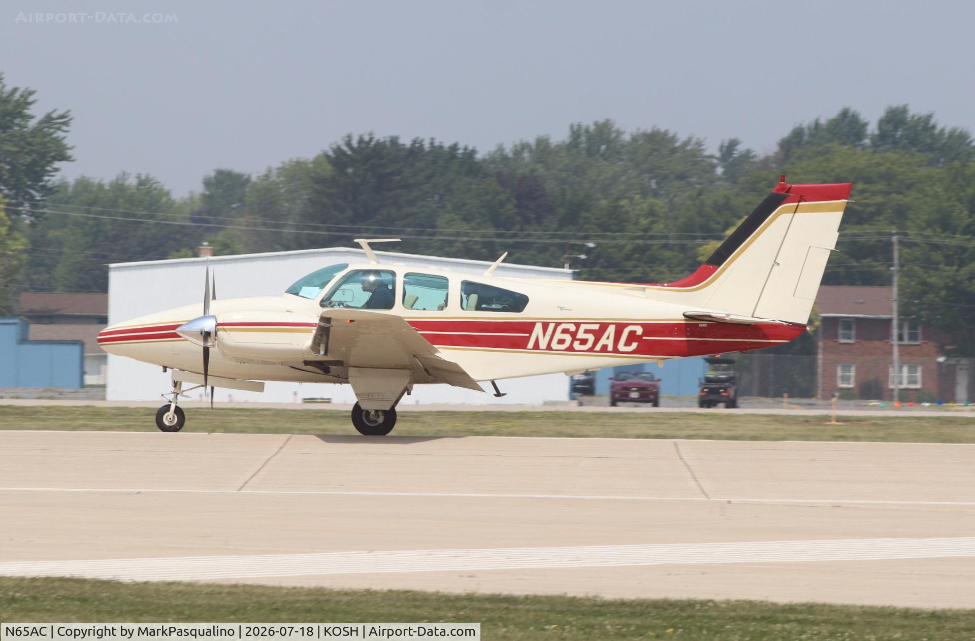 Aircraft N65AC, 1966 Beech C55 Baron (95-C55), c/n TE-242, Beech C55, at KOSH, photo by MarkPasqualino
