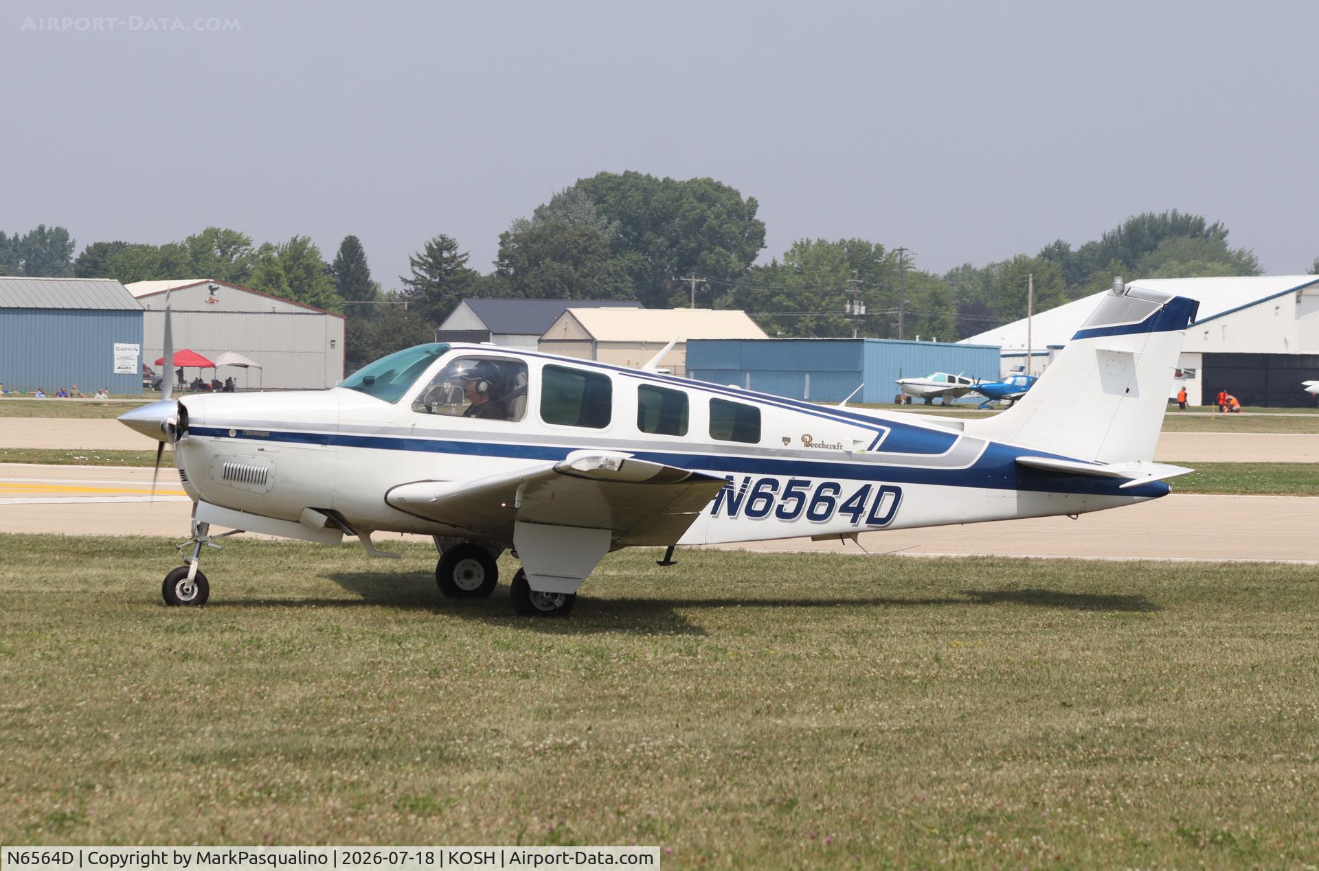 Aircraft N6564D, 1982 Beech A36 Bonanza 36, c/n E-2048, Beech A36, at KOSH, photo by MarkPasqualino