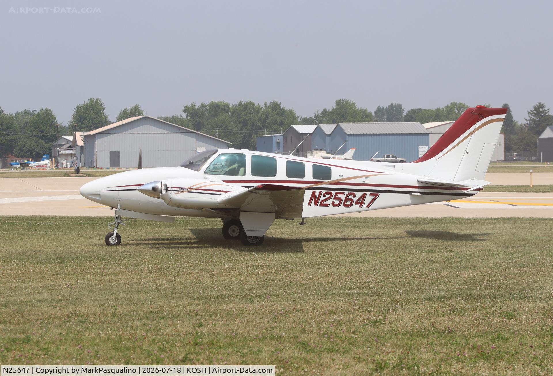 Aircraft N25647, 1973 Beech 58 Baron, c/n TH-301, Beech 58, at KOSH, photo by MarkPasqualino