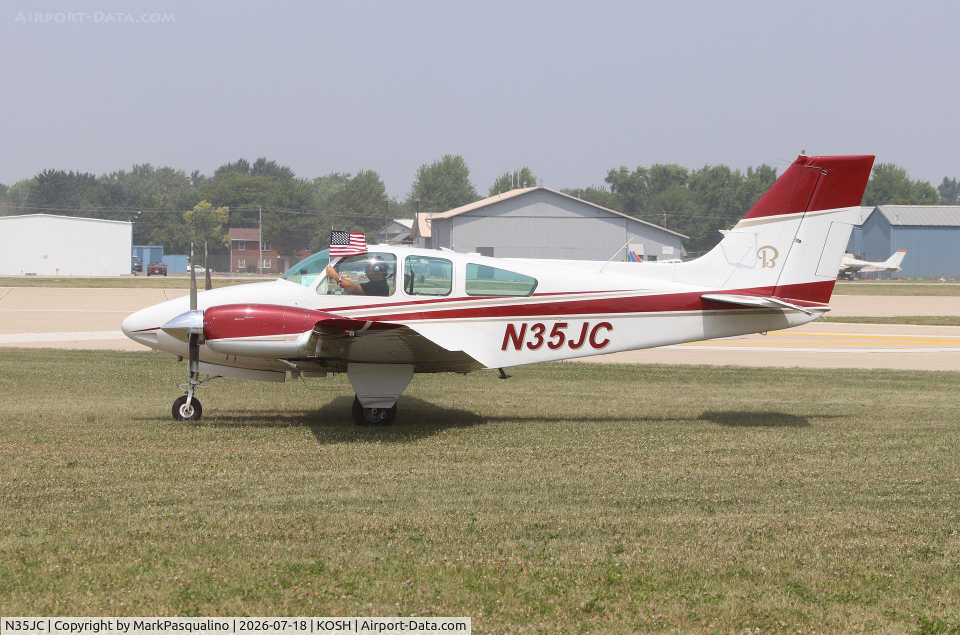 Aircraft N35JC, 1964 Beech 95-B55 (T42A) Baron, c/n TC-828, Beech B55, at KOSH, photo by MarkPasqualino