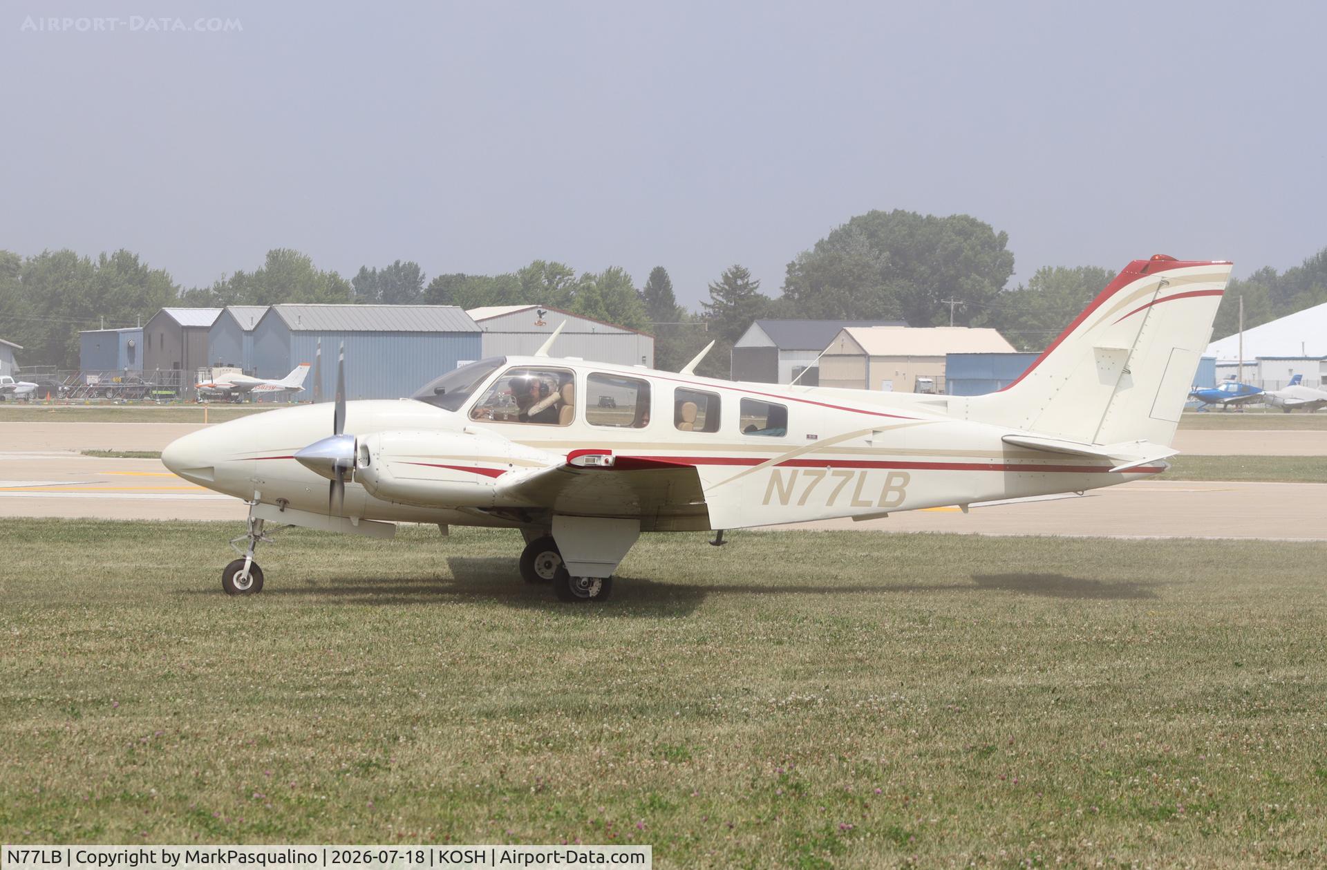 Aircraft N77LB, 1974 Beech 58 Baron, c/n TH-536, Beech 58, at KOSH, photo by MarkPasqualino