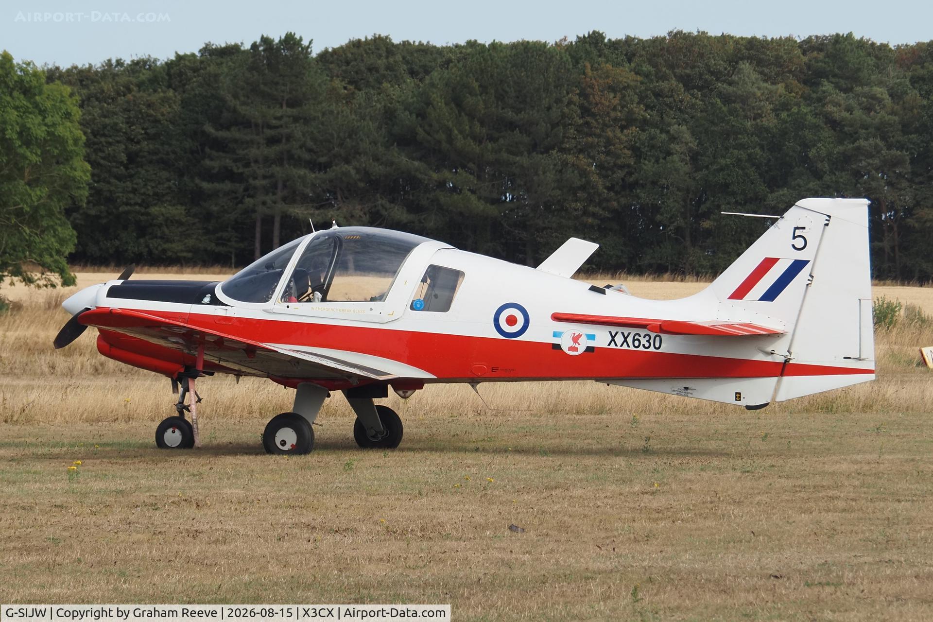 Aircraft G-SIJW, 1974 Scottish Aviation Bulldog Series 120 Model 121, c/n BH120/295, Parked at Northrepps., at X3CX, photo by Graham Reeve