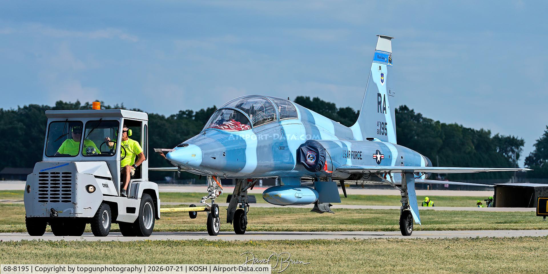 Aircraft 68-8195, 1969 Northrup T-38C Talon, c/n T6200, KATANA1 being towed off of Boeing Plaza, at KOSH, photo by topgunphotography
