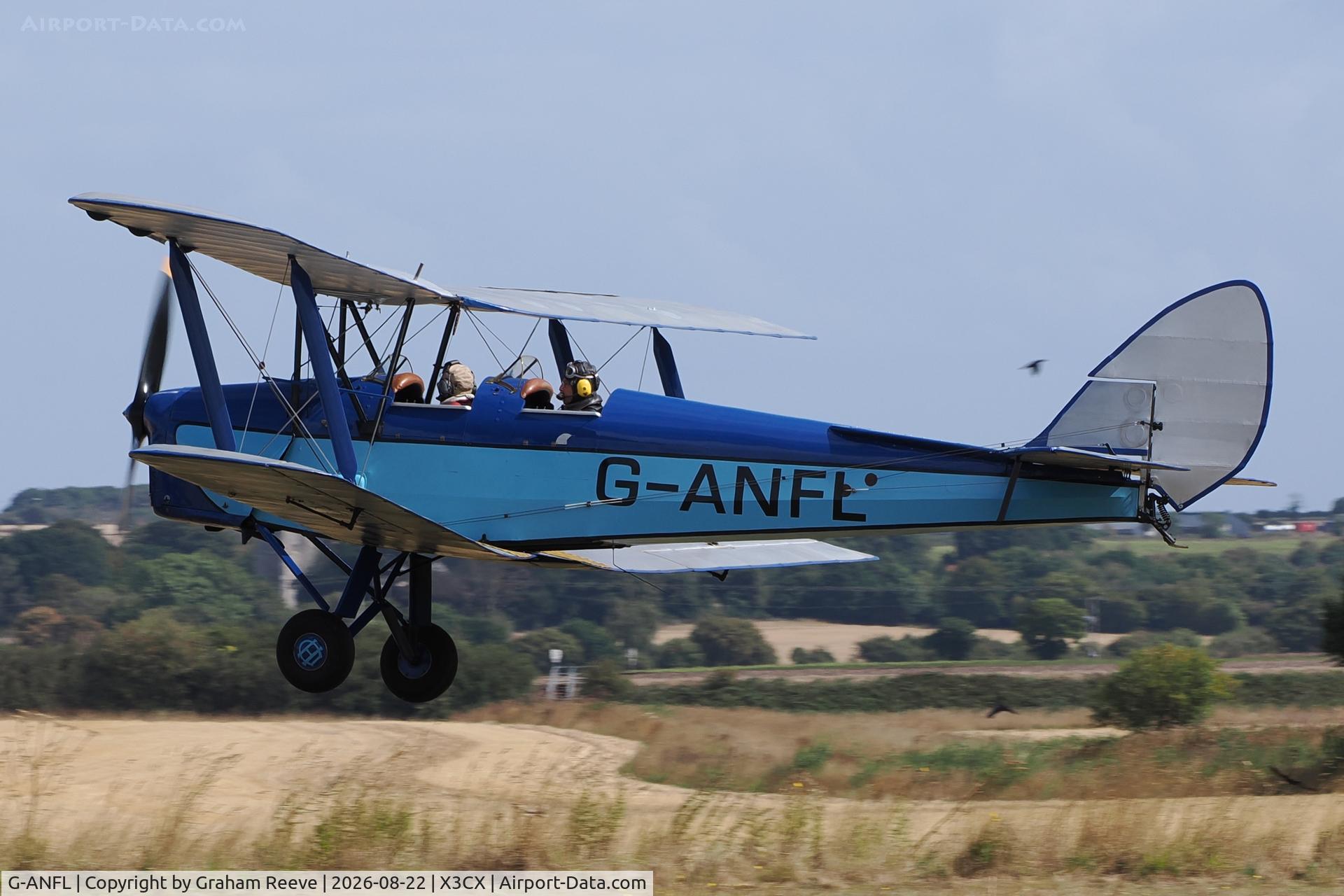 Aircraft G-ANFL, 1941 De Havilland DH-82A Tiger Moth II, c/n 84617, Landing at Northrepps., at X3CX, photo by Graham Reeve