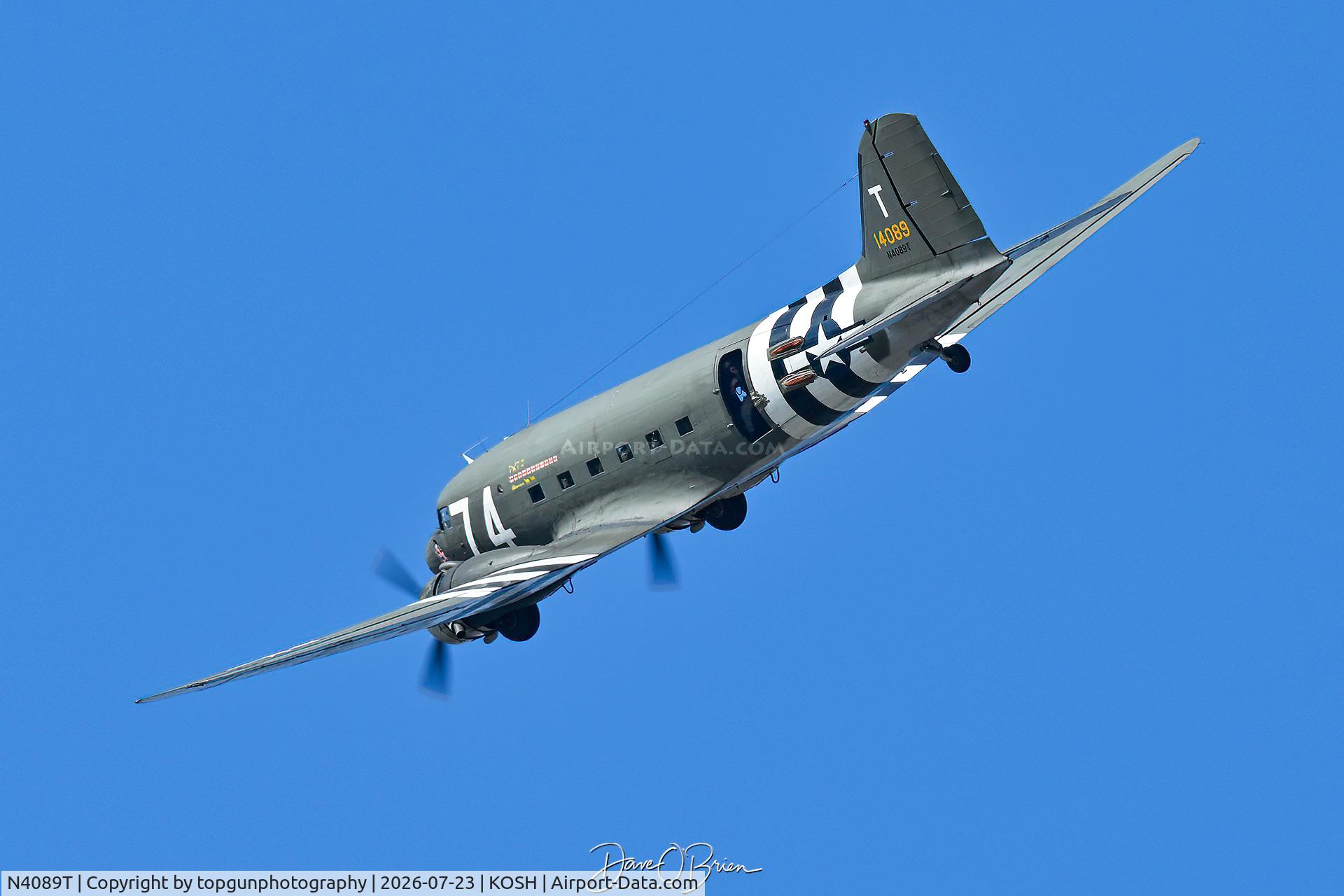 Aircraft N4089T, 1941 Douglas DC-3, c/n 4089, WILDKAT1 makes a wind check pass to set up for jumpers, at KOSH, photo by topgunphotography