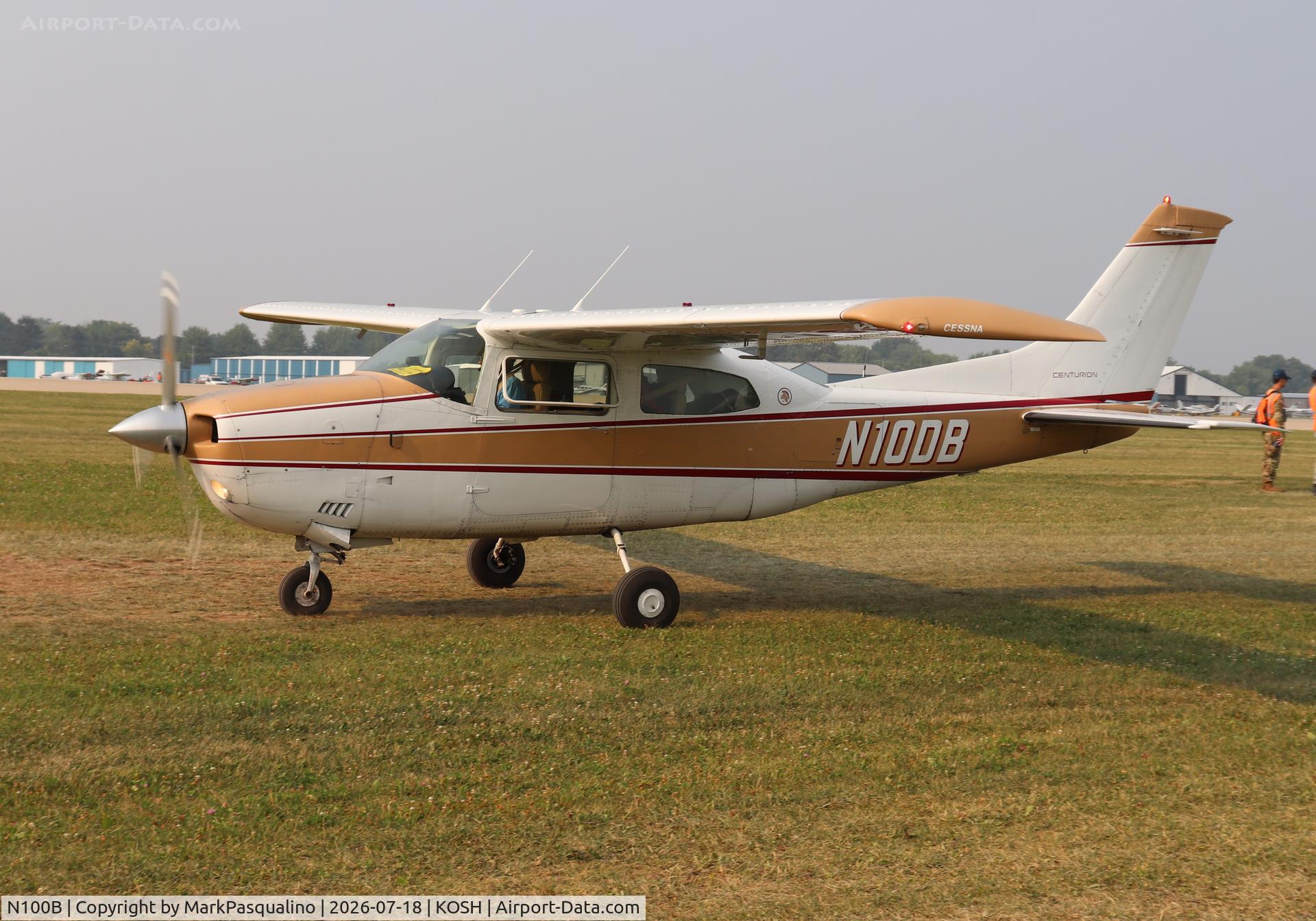 Aircraft N100B, Cessna 210, c/n 57114, Cessna 210, at KOSH, photo by MarkPasqualino