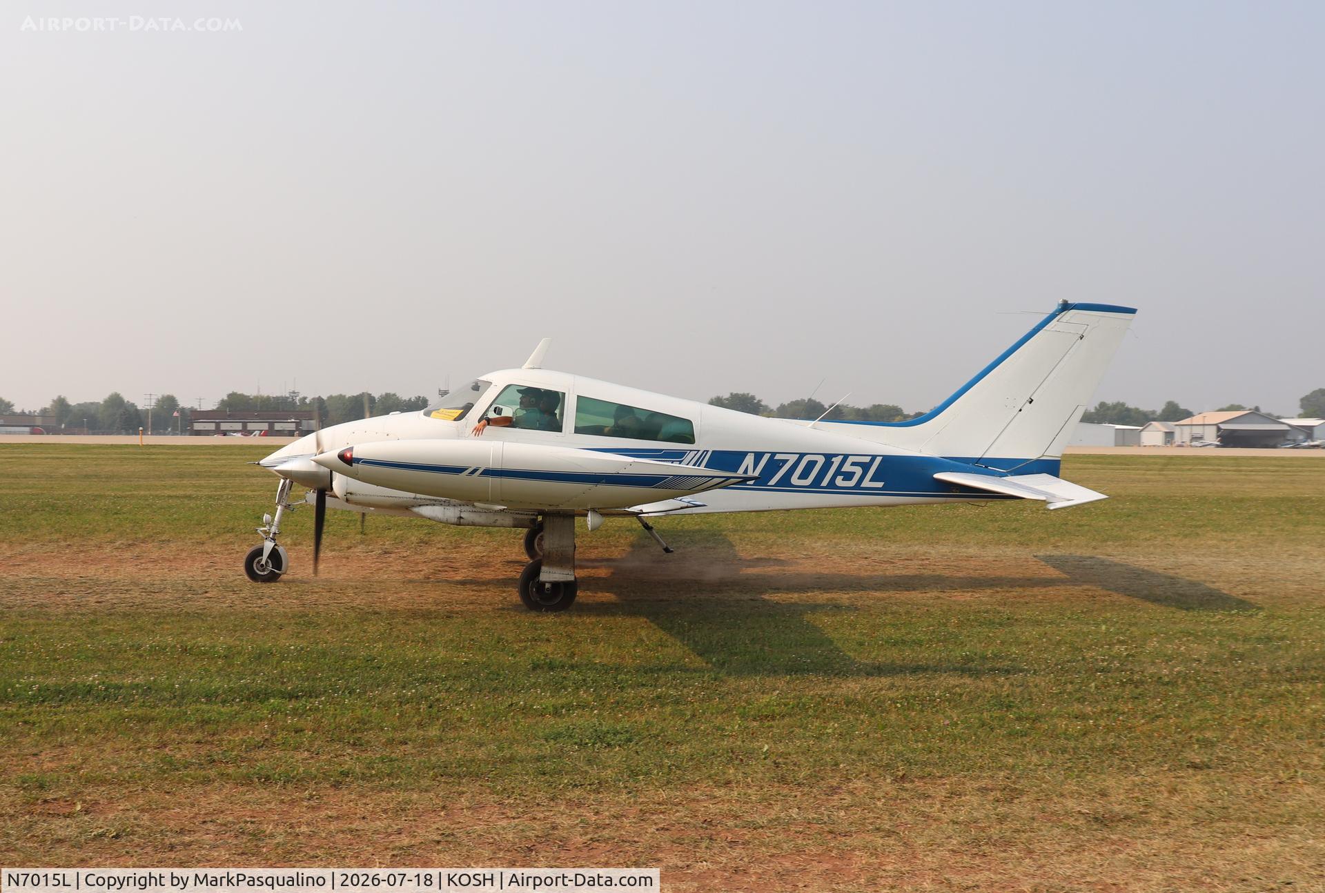 Aircraft N7015L, 1966 Cessna 310K, c/n 310K0115, Cessna 310K, at KOSH, photo by MarkPasqualino
