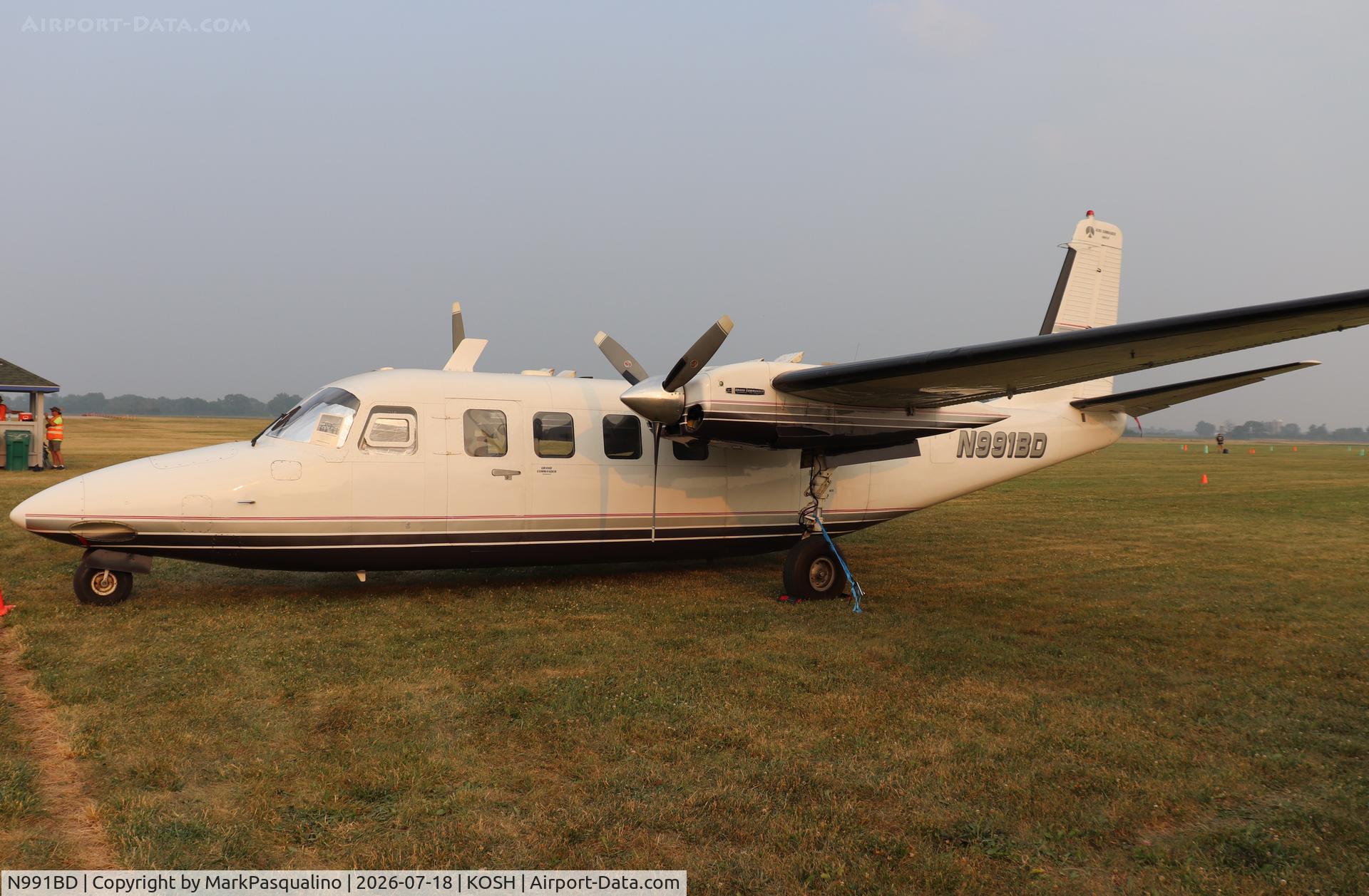 Aircraft N991BD, 1964 Aero Commander 680FLP Commander, c/n 1483-8, Aero Commander 680FLP, at KOSH, photo by MarkPasqualino