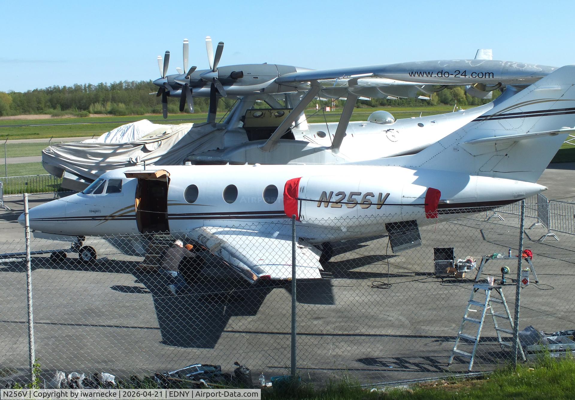Aircraft N256V, 1979 Dassault Falcon 10, c/n 151, Dassault Falcon 10 undergoing maintenance outside the Dornier Museum at the Bodensee airport, Friedrichshafen, at EDNY, photo by iwarnecke